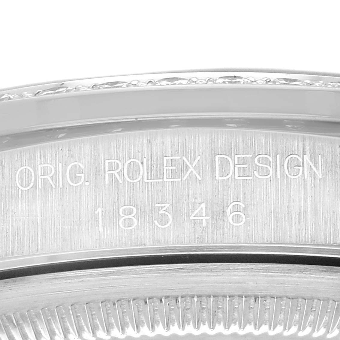 The image shows a close-up of the engraved bezel of a Rolex President 18346 Men's Platinum Blue Dial 18346 Men's Platinum Blue Dial model watch, displaying its design number.