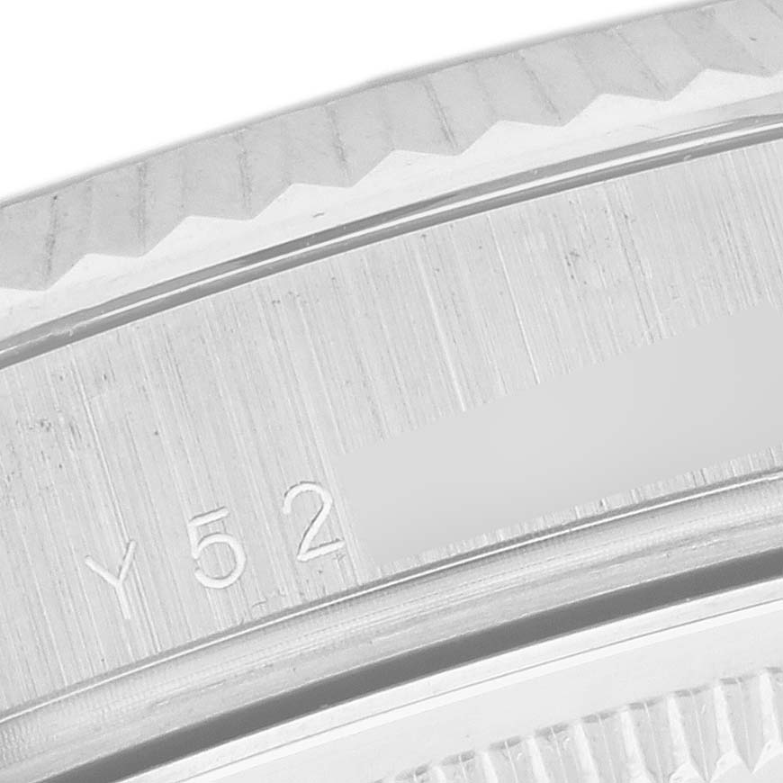 The image shows a close-up of the bezel and case edge of a Rolex President 118239 Men's White Gold Mother of Pearl Dial 118239 Men's White Gold Mother of Pearl Dial model, highlighting engraved markings.