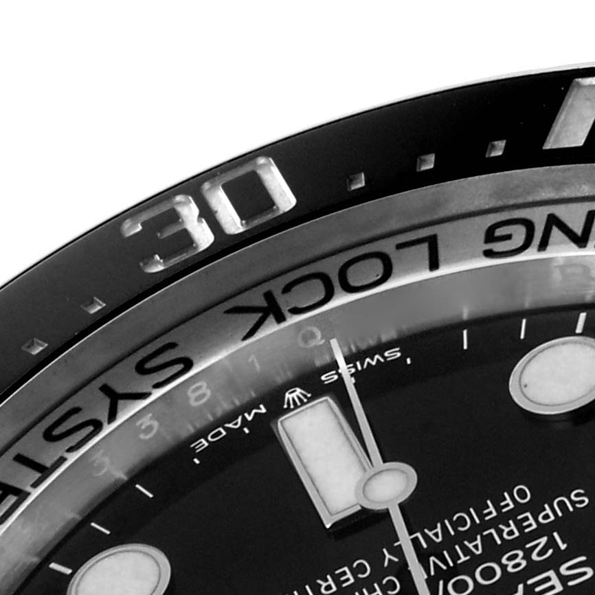 The image shows a close-up of the bezel and dial of a Rolex Sea-Dweller 126660 Men's Stainless Steel Black Dial 126660 Men's Stainless Steel Black Dial watch, focusing on the 30-minute marker and part of the hands.