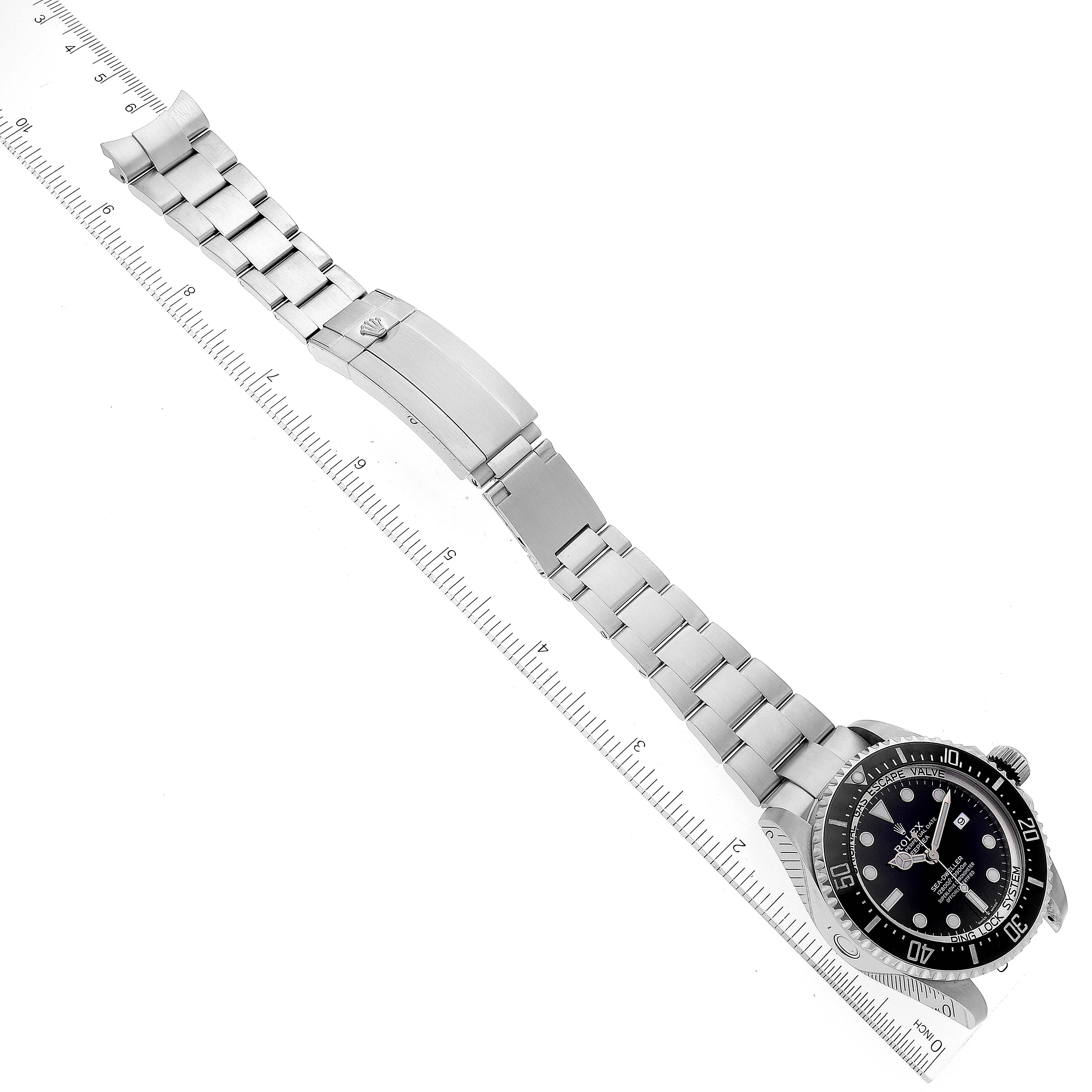 The image shows a Rolex Sea-Dweller 126660 Men's Stainless Steel Black Dial 126660 Men's Stainless Steel Black Dial watch laid flat, displaying the face, bezel, bracelet, and clasp at an angled top view.