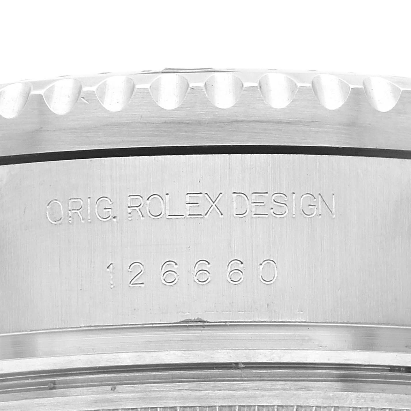 This image shows the case back and part of the bezel, with the text "Orig. Rolex Design" and the model number "126660" engraved.