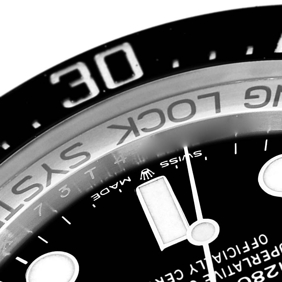 The image shows a close-up of the bezel and dial of a Rolex Sea-Dweller 126660 Men's Stainless Steel Black Dial 126660 Men's Stainless Steel Black Dial watch, including part of the 30-minute marker and text.