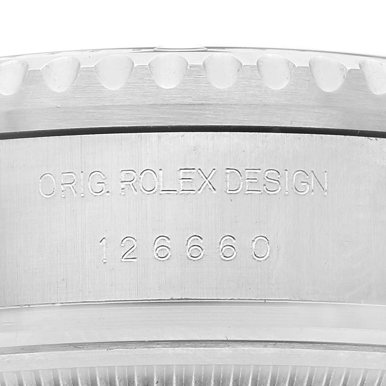 The image shows a close-up of the side of the bezel and case of a Rolex Sea-Dweller 126660 Men's Stainless Steel Black Dial 126660 Men's Stainless Steel Black Dial model, showcasing its reference number 126660.