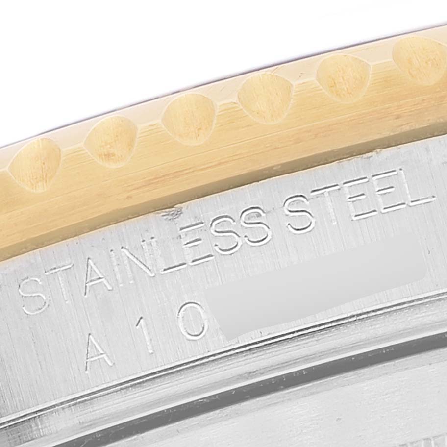 This image shows a close-up of the watch case edge and engraved details of a Rolex Submariner 16613 Men's Steel and Gold (two tone) Blue Dial 16613 Men's Steel and Gold (two tone) Blue Dial model.