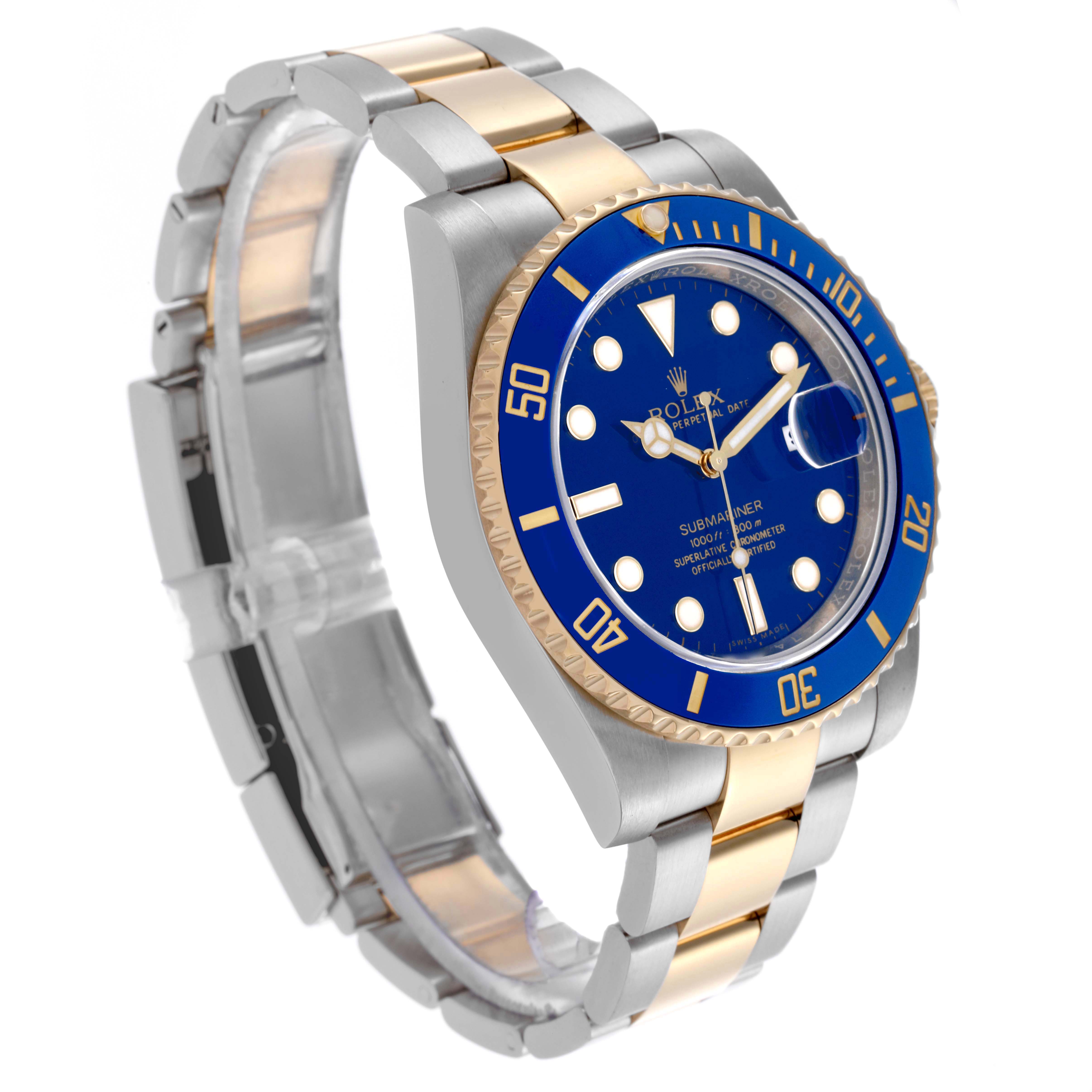 The Rolex Submariner 116613LB Men's Steel and Gold (two tone) Blue Dial 116613LB Men's Steel and Gold (two tone) Blue Dial is shown at a three-quarter angle, featuring the case, blue bezel, dial, and two-tone bracelet.