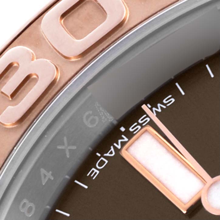 The image shows a close-up of the Yacht-Master Rolex's bezel and part of the dial and hands.