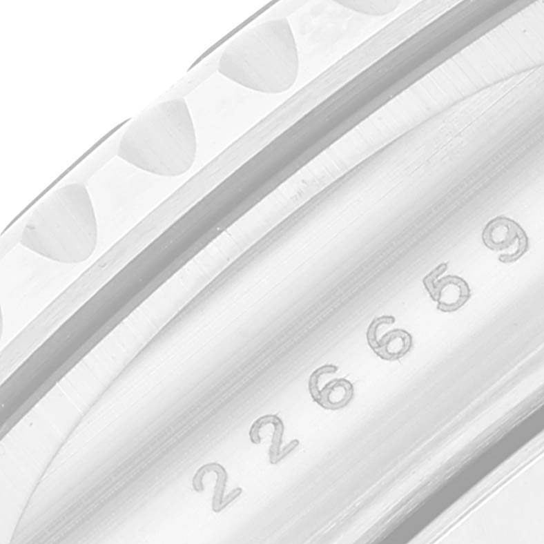 This close-up image shows the bezel and the engraved serial number of the Rolex Yacht-Master 226659 Men's White Gold Black Dial 226659 Men's White Gold Black Dial watch.