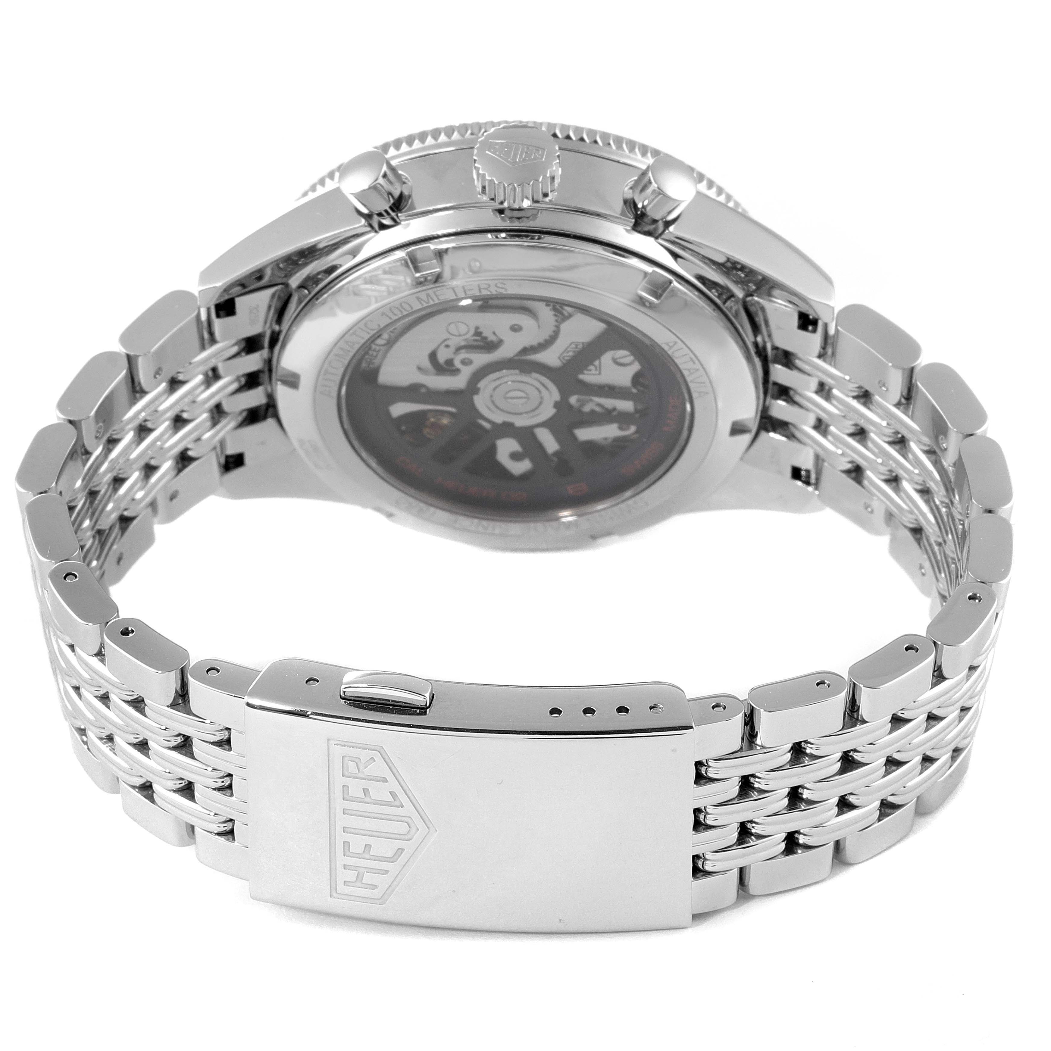 The image shows the back view of a Tag Heuer Autavia CBE2110.BA0687 Men's Stainless Steel Black Dial CBE2110.BA0687 Men's Stainless Steel Black Dial watch, highlighting its clasp, crown, and part of the movement through the transparent case back.