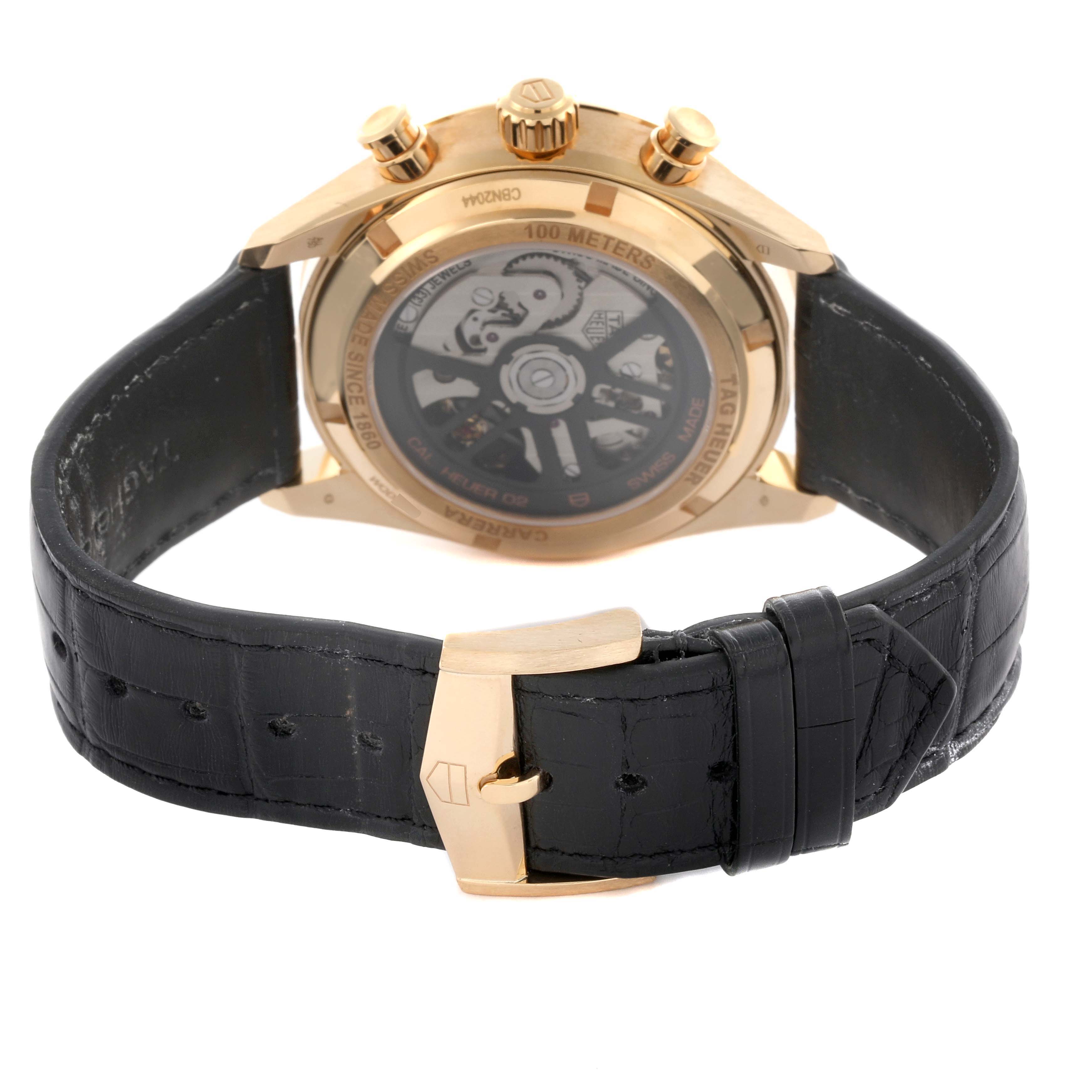 The image shows the back view of a Tag Heuer Carrera CBN2044.FC8313 Men's Yellow Gold Black Dial CBN2044.FC8313 Men's Yellow Gold Black Dial watch, highlighting the movement and leather strap with clasp.