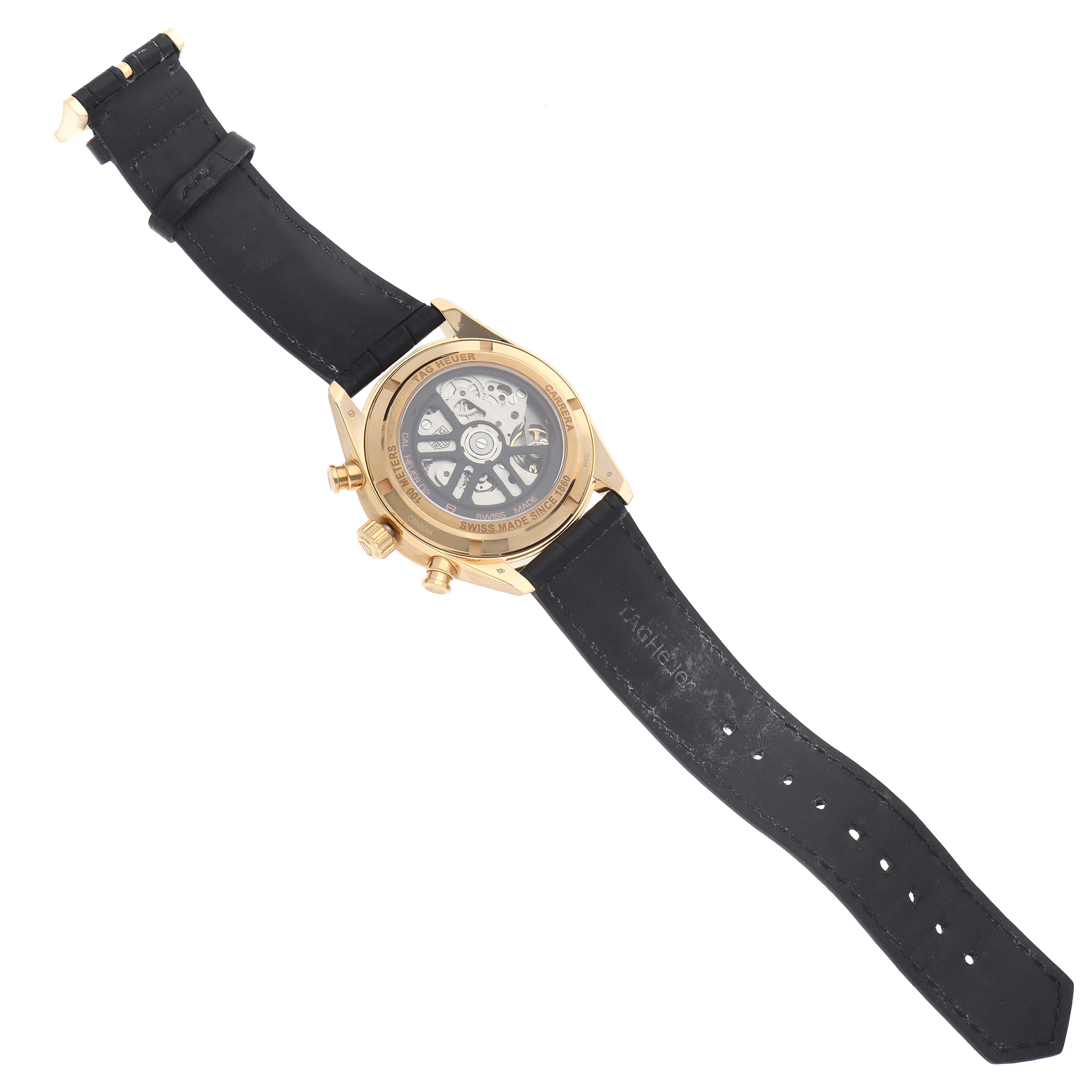 The Tag Heuer Carrera CBN2044.FC8313 Men's Yellow Gold Black Dial CBN2044.FC8313 Men's Yellow Gold Black Dial watch is shown from the back, displaying its movement and black strap.