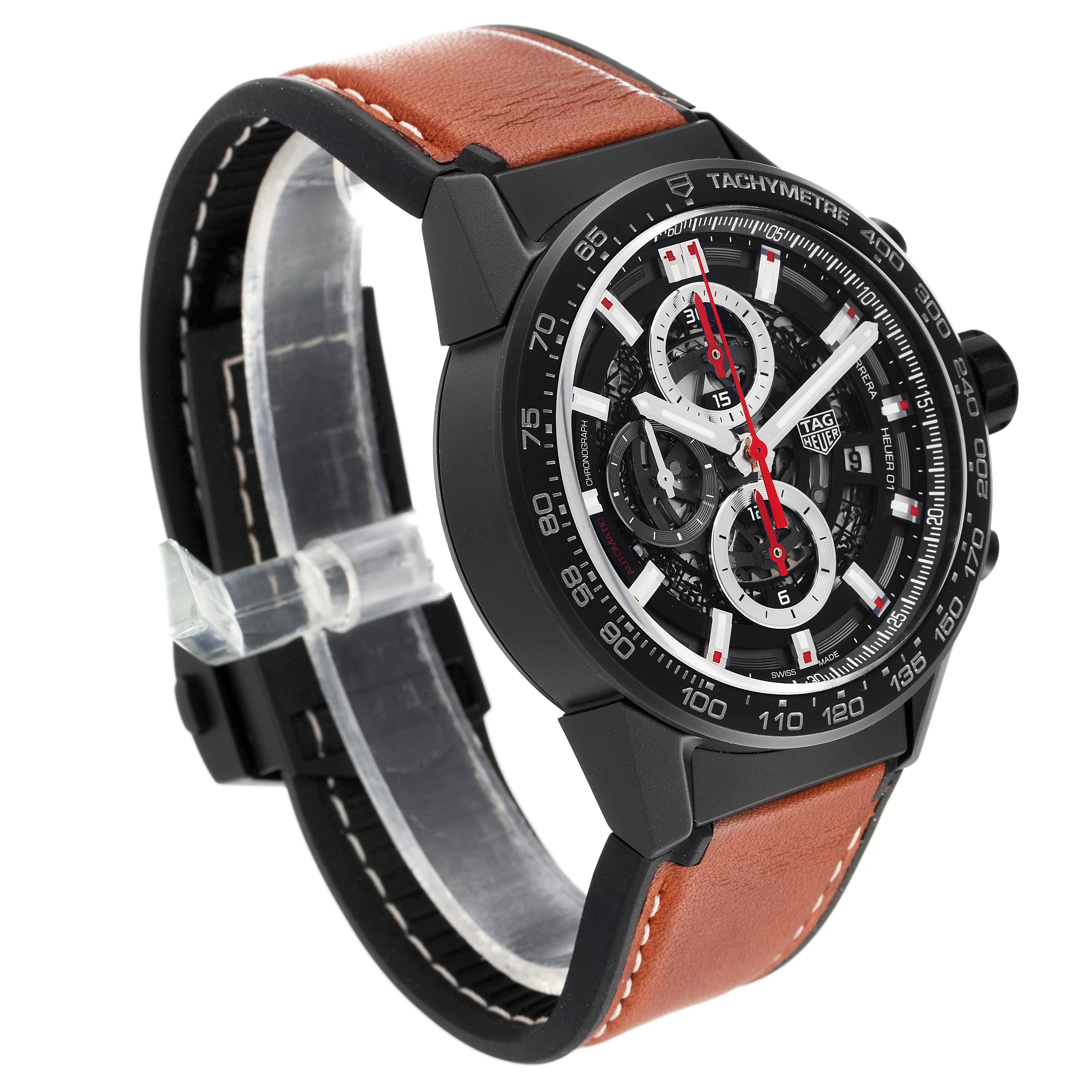 The image shows the Tag Heuer Carrera CAR2090.BH0729 Men's Ceramic Black Dial CAR2090.BH0729 Men's Ceramic Black Dial watch at an angle, revealing its face, tachymeter bezel, and brown leather strap.