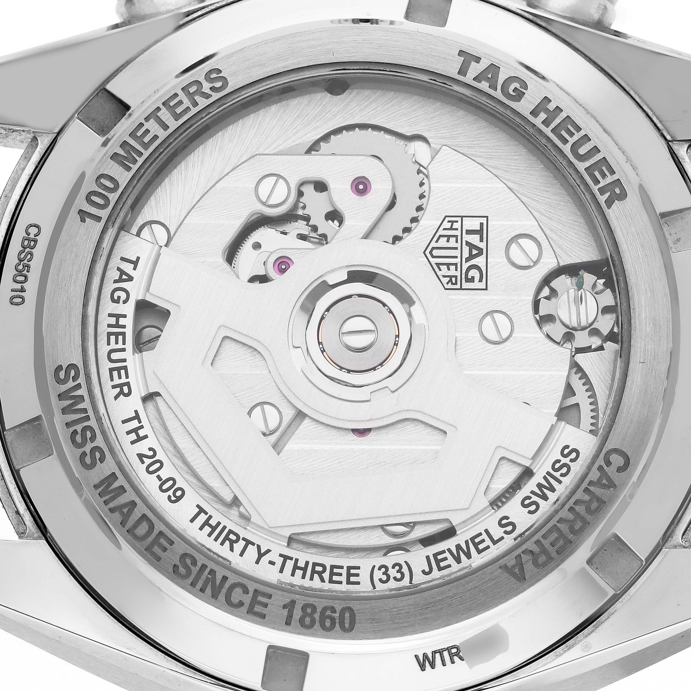 The image shows the back of the Tag Heuer Carrera CBS5010.FC6543 Men's Stainless Steel Blue Dial CBS5010.FC6543 Men's Stainless Steel Blue Dial watch, highlighting the movement and engraving details.