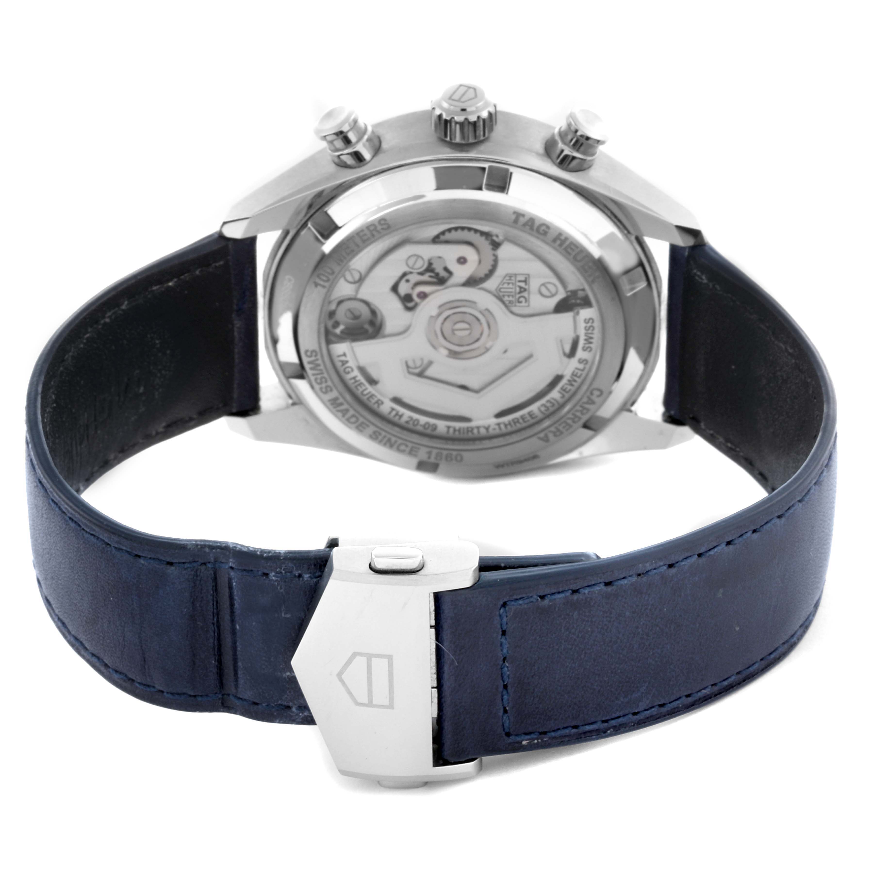 The image shows the back of the Tag Heuer Carrera CBS5010.FC6543 Men's Stainless Steel Blue Dial CBS5010.FC6543 Men's Stainless Steel Blue Dial watch, highlighting the automatic movement and blue leather strap.