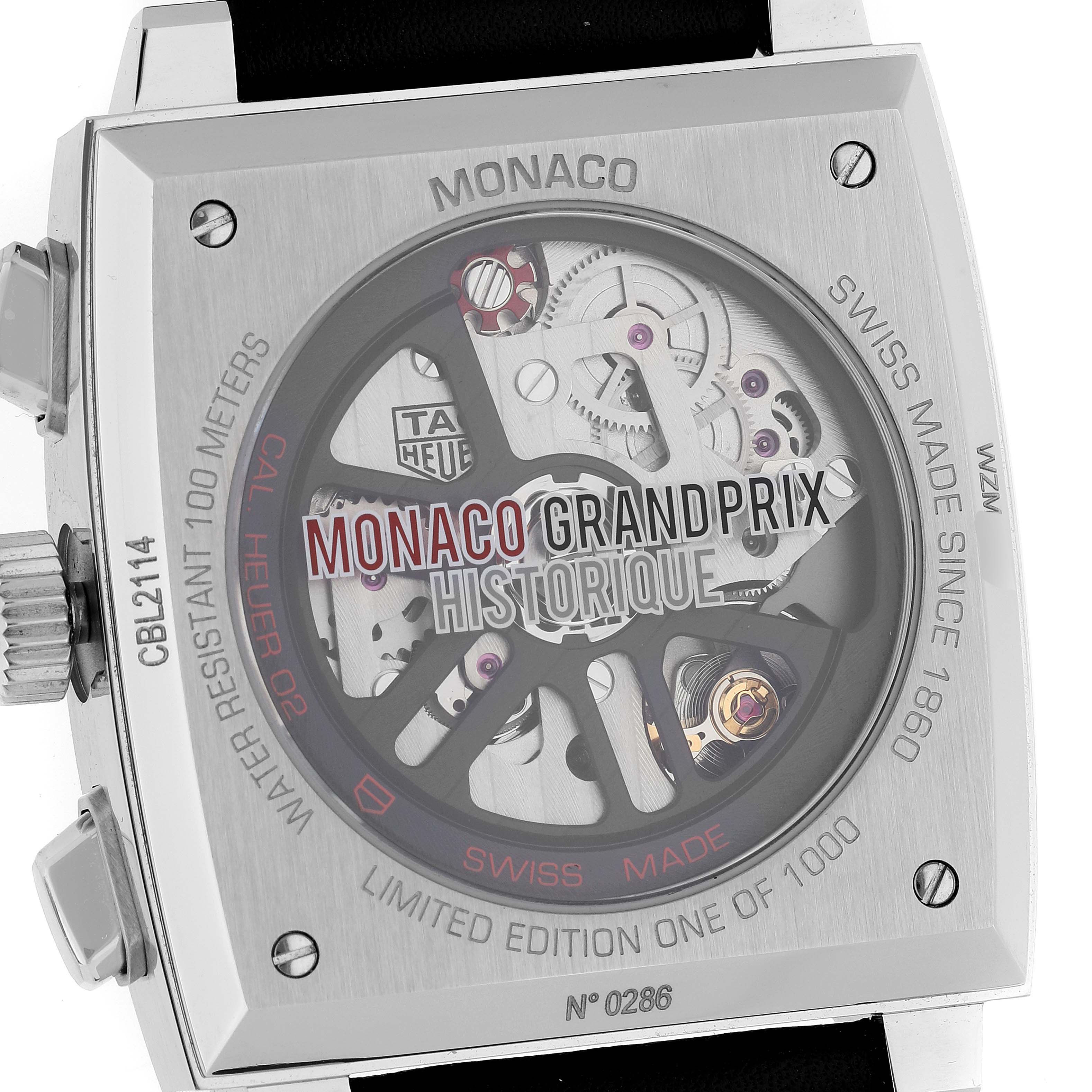 This image shows the back of a Tag Heuer Monaco CBL2114.FC6486 Men's Stainless Steel Red Dial CBL2114.FC6486 Men's Stainless Steel Red Dial watch, highlighting its "Monaco Grand Prix Historique" engraving and internal mechanisms.