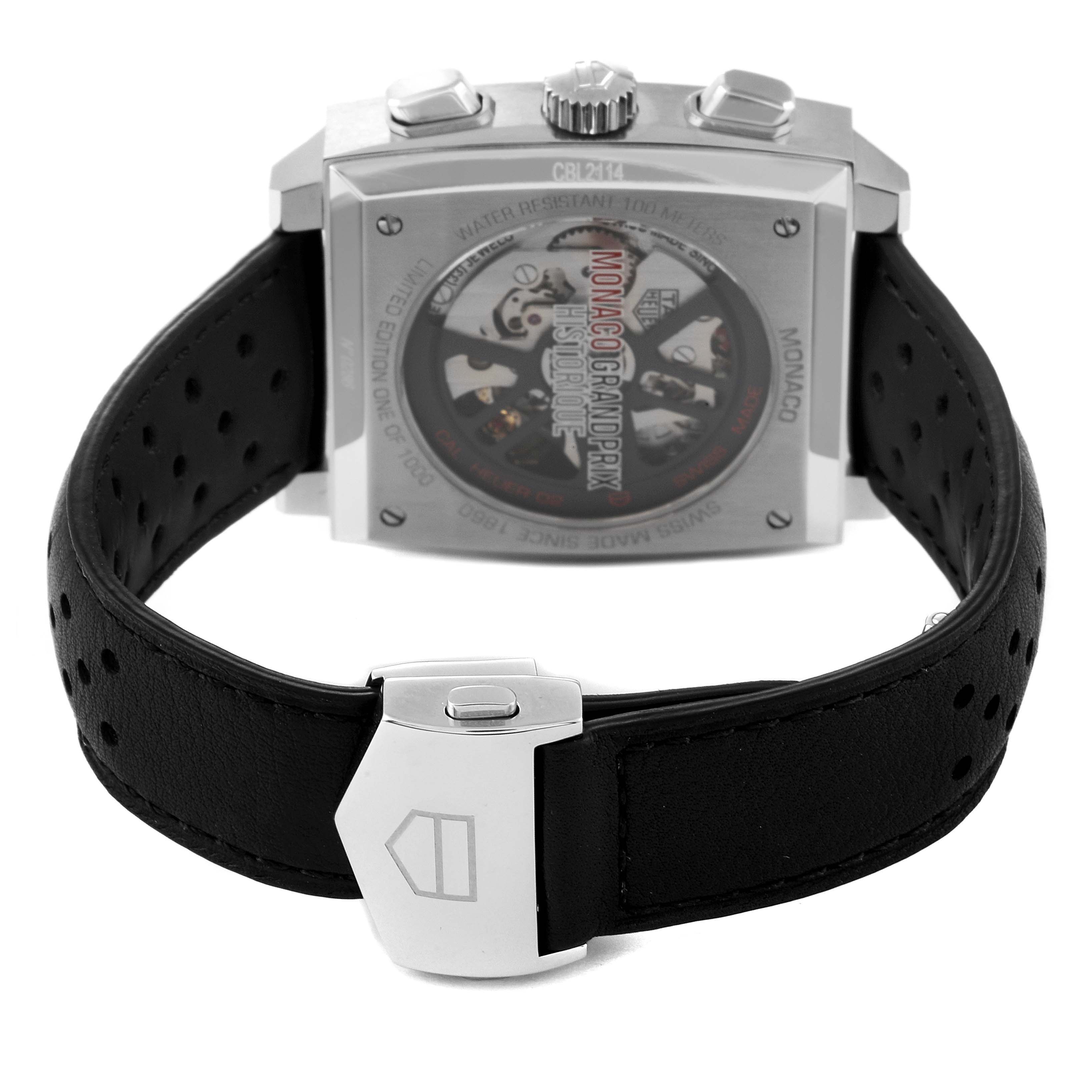 The image shows the back case and clasp of the Tag Heuer Monaco CBL2114.FC6486 Men's Stainless Steel Red Dial CBL2114.FC6486 Men's Stainless Steel Red Dial watch, highlighting its perforated leather strap and buckle.
