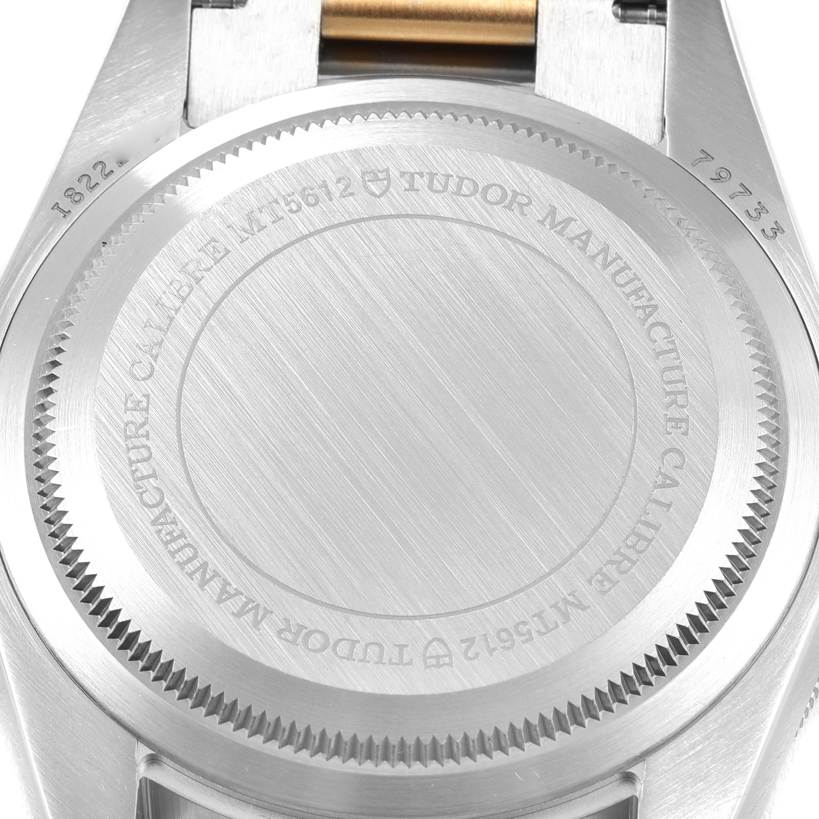 This image shows the back case of the Tudor Heritage Black Bay 79733 Men's Steel and Gold (two tone) Black Dial 79733 Men's Steel and Gold (two tone) Black Dial watch, highlighting its model number and brand engraving.