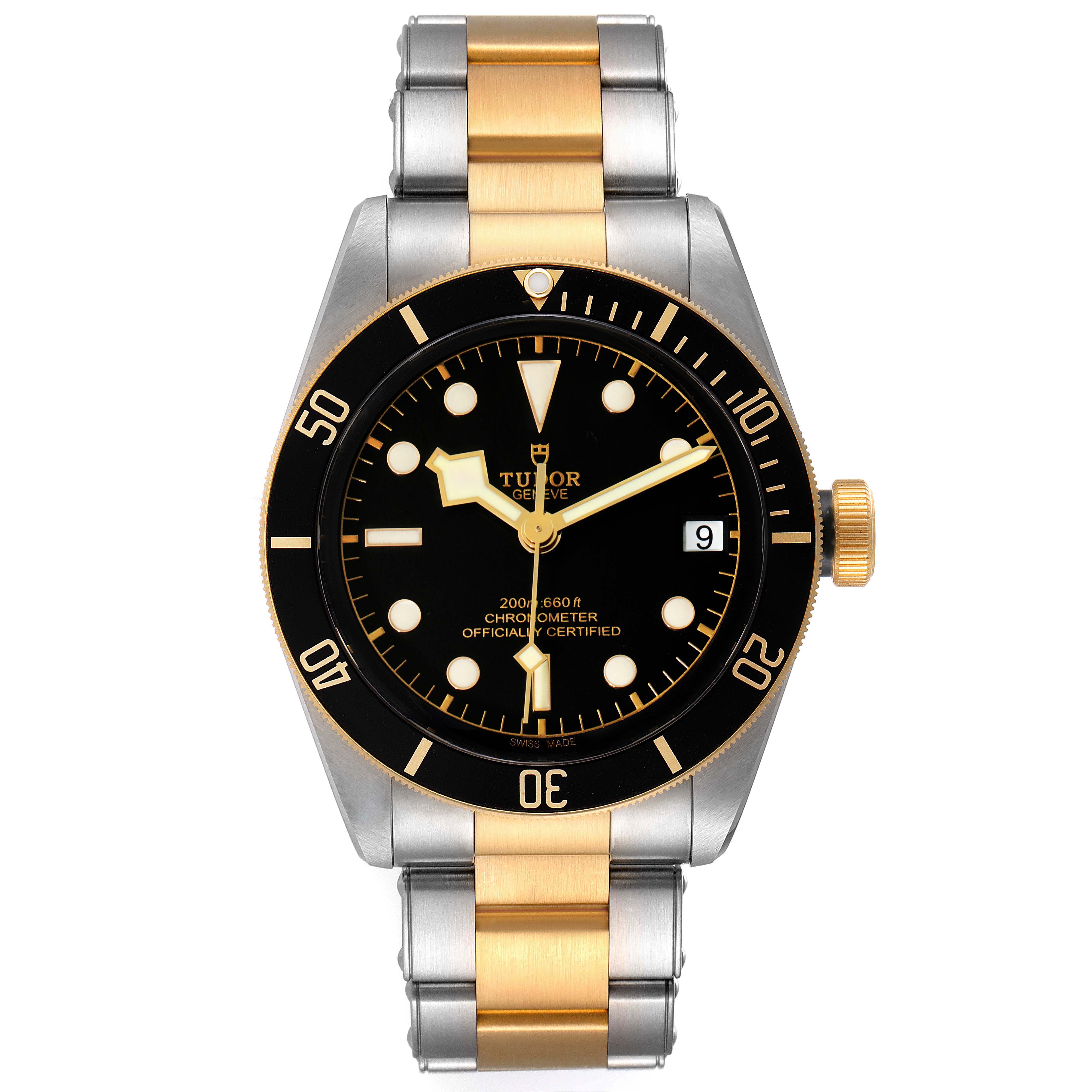 This image shows a front view of the Tudor Heritage Black Bay 79733 Men's Steel and Gold (two tone) Black Dial 79733 Men's Steel and Gold (two tone) Black Dial watch, featuring its black dial, gold bezel, and two-tone bracelet.