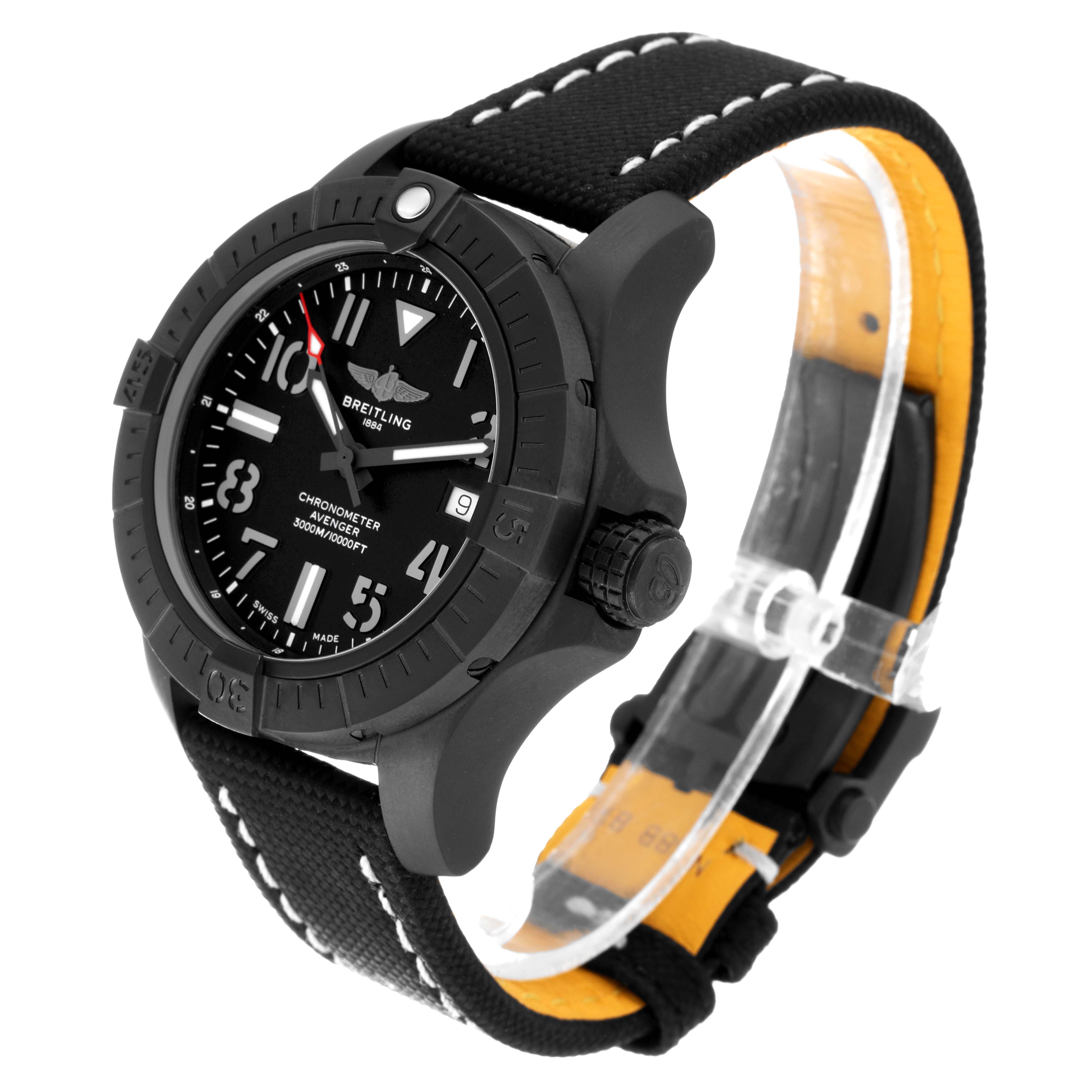 The Breitling Avenger V17319 Men's Titanium Black Dial V17319 Men's Titanium Black Dial watch is shown at an angled side view, displaying its black dial, bezel, crown, and fabric strap with white stitching.