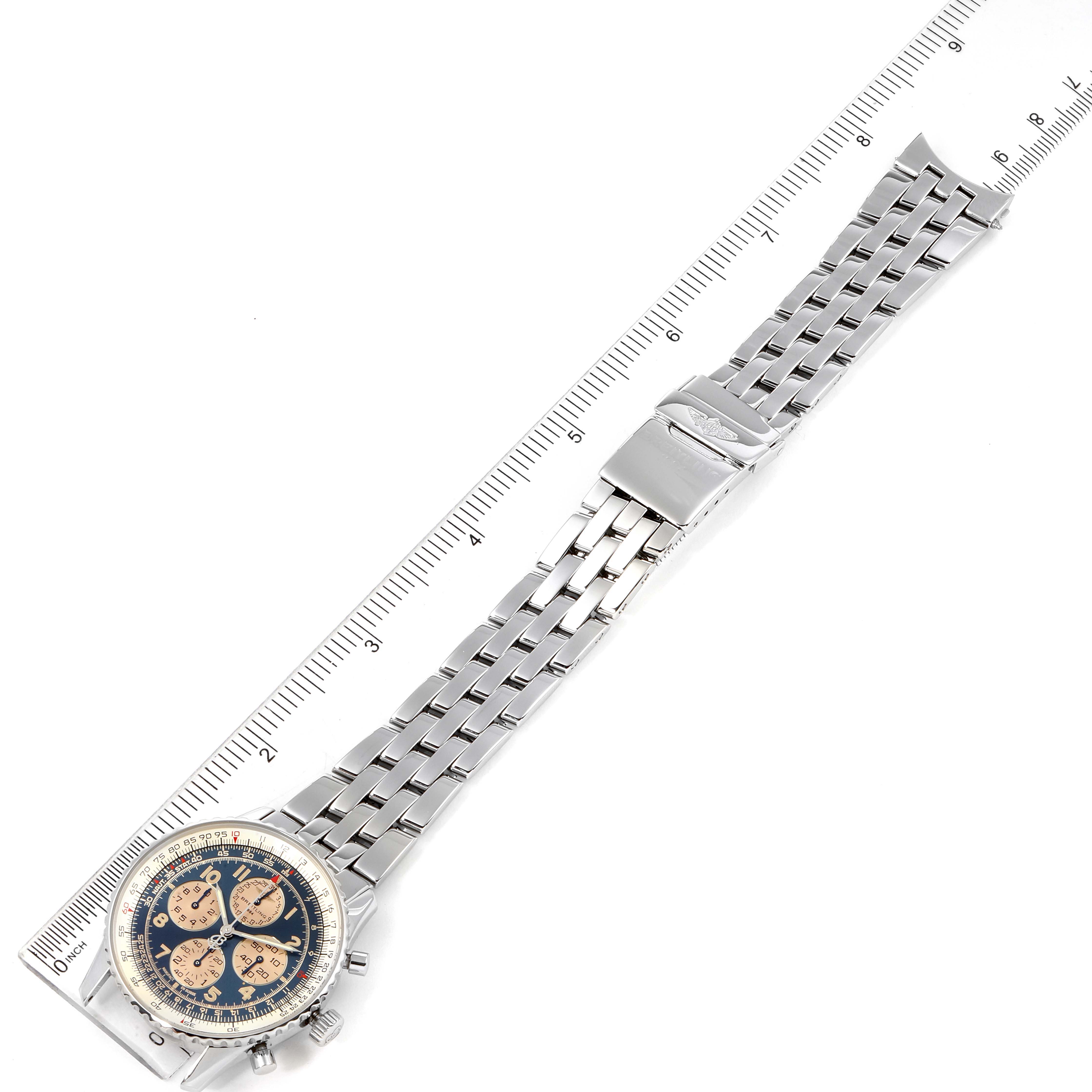 The image shows a Breitling Navitimer A33030 Men's Stainless Steel Blue Dial A33030 Men's Stainless Steel Blue Dial watch laid flat alongside a ruler, highlighting the bracelet and the watch face.