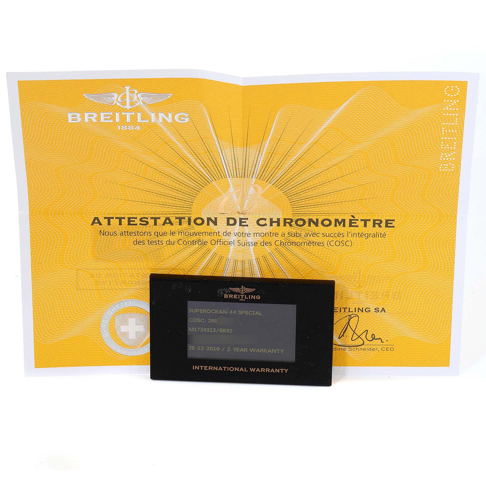 The image shows a warranty card and certificate of authenticity for the Breitling Superocean M17393 Men's Stainless Steel Black Dial M17393 Men's Stainless Steel Black Dial watch model.