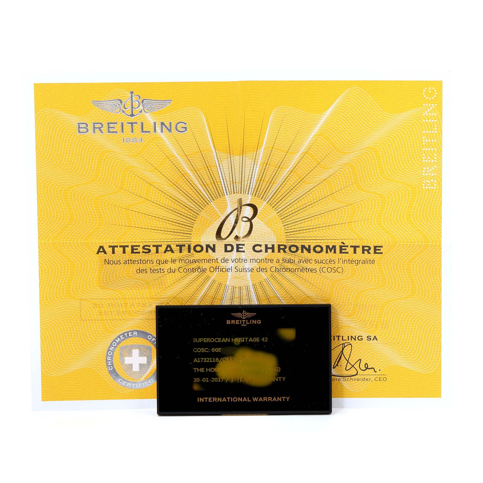 The image shows the warranty card and COSC certificate for the Breitling Superocean A17321 Men's Stainless Steel Blue Dial A17321 Men's Stainless Steel Blue Dial model watch.