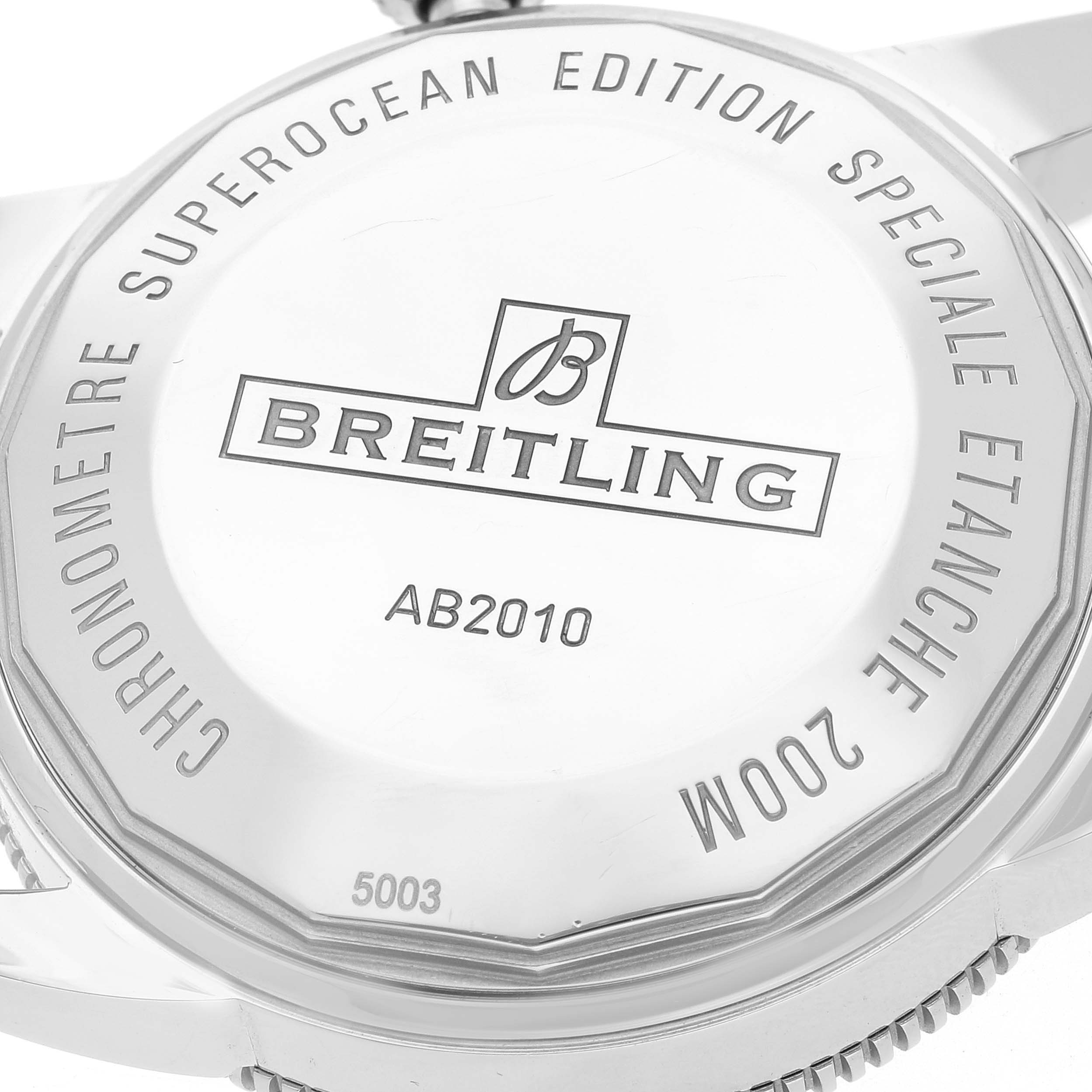 This image shows the case back of a Breitling Superocean AB2010 Men's Stainless Steel Brown Dial AB2010 Men's Stainless Steel Brown Dial watch model, displaying engravings and model information.