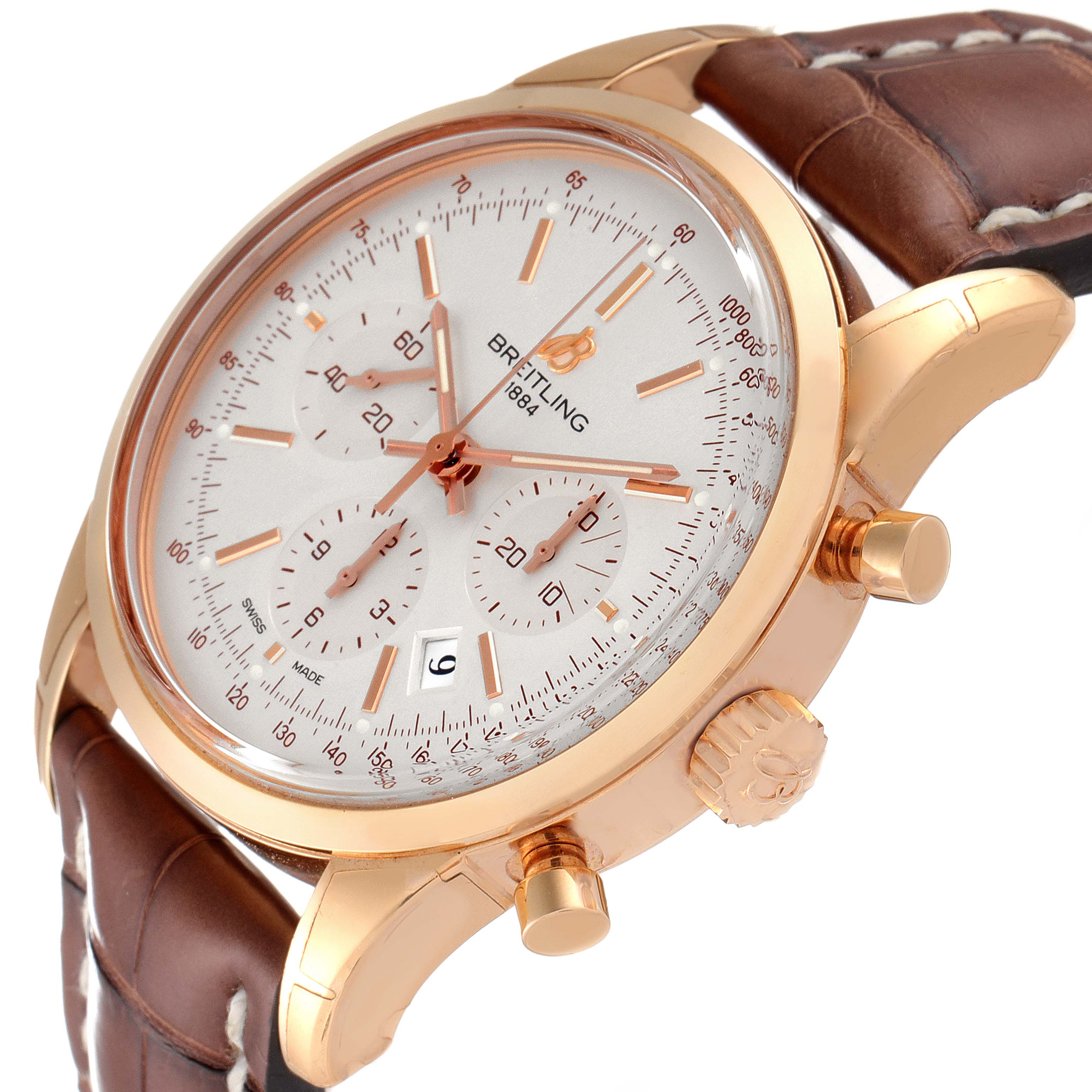 The image shows a close-up angle of a Breitling Transocean RB0152 Men's Rose Gold Silver Dial RB0152 Men's Rose Gold Silver Dial watch, highlighting the dial, crown, pushers, and leather strap.