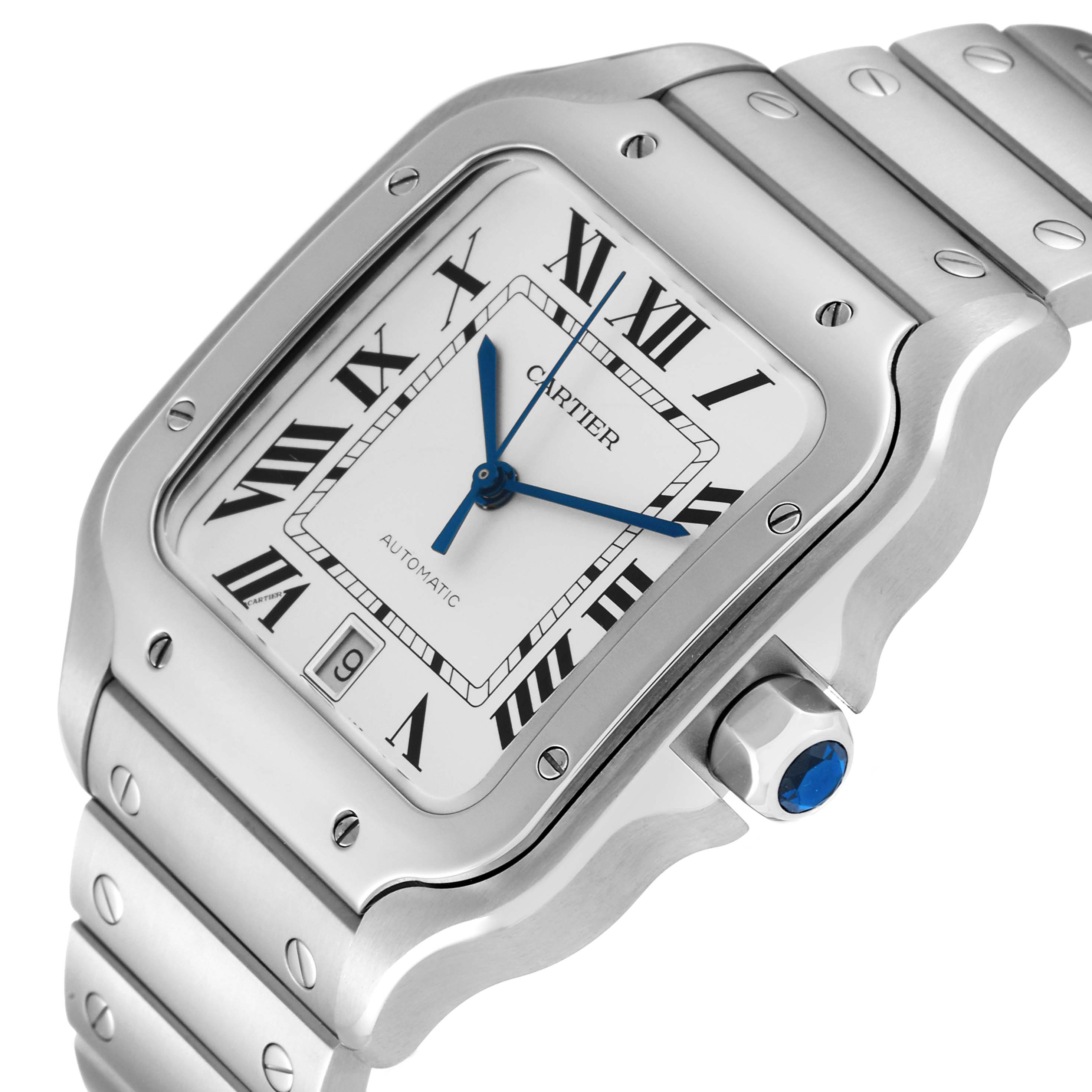 The image shows a close-up angle of the Cartier Santos WSSA0018 Men's Stainless Steel Silver Dial WSSA0018 Men's Stainless Steel Silver Dial watch, highlighting its face, bezel, crown, and part of the bracelet.