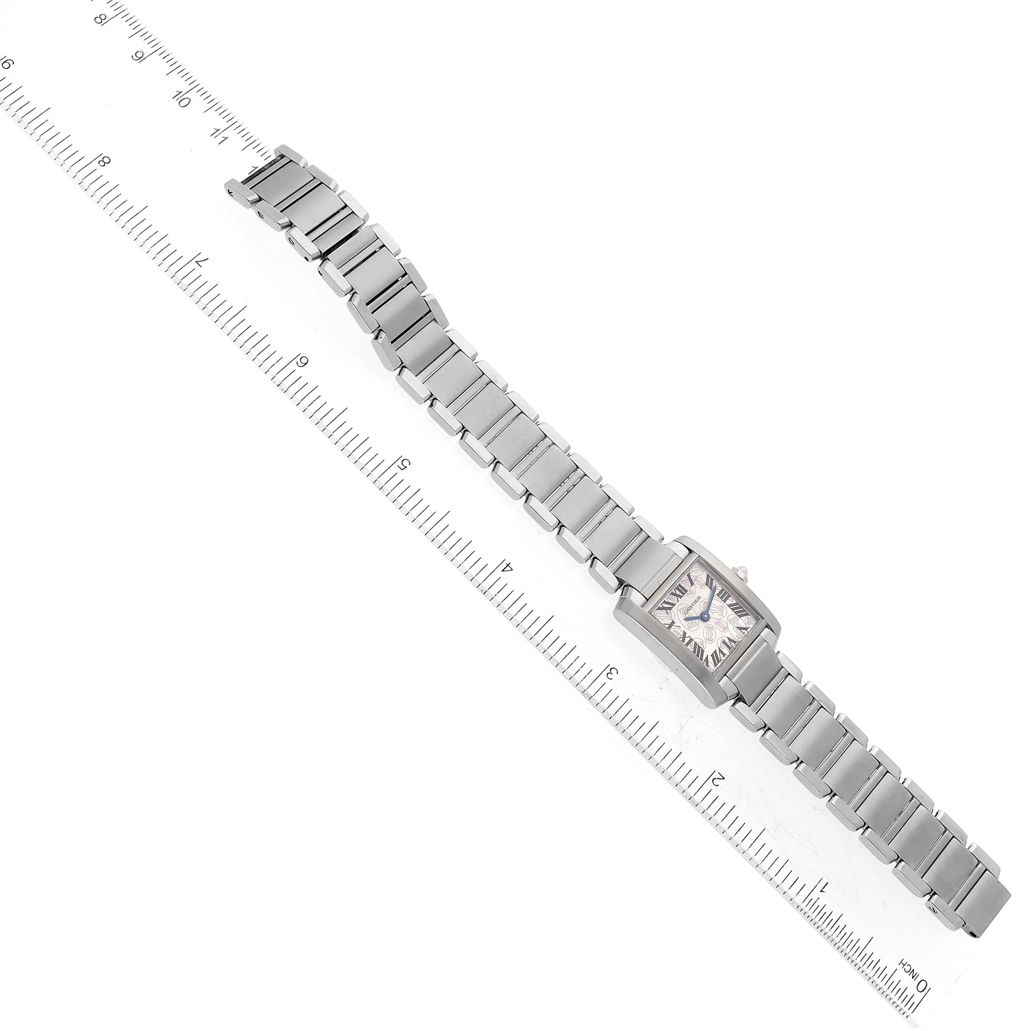 The image shows a Cartier Tank Française watch, displayed flat and alongside a ruler for scale reference.