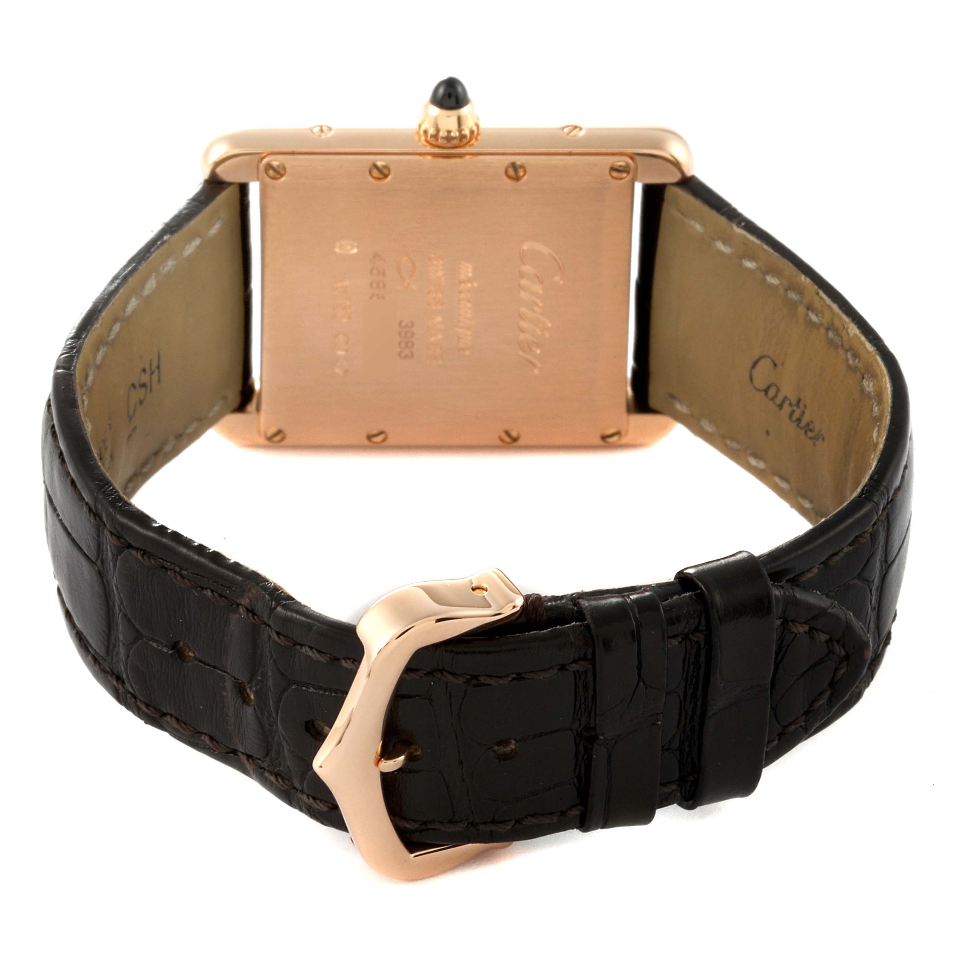 This image shows the back view of a Tank Louis model by Cartier, displaying the case, crown, and leather strap with buckle.
