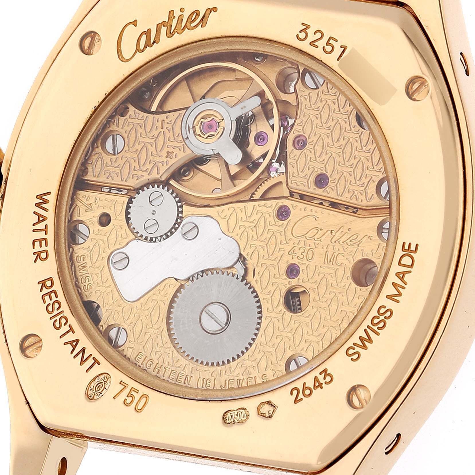 This image shows the back of the Cartier Tortue WA5071W8 Women's Yellow Gold Silver Dial WA5071W8 Women's Yellow Gold Silver Dial watch, highlighting its internal mechanism and engravings.