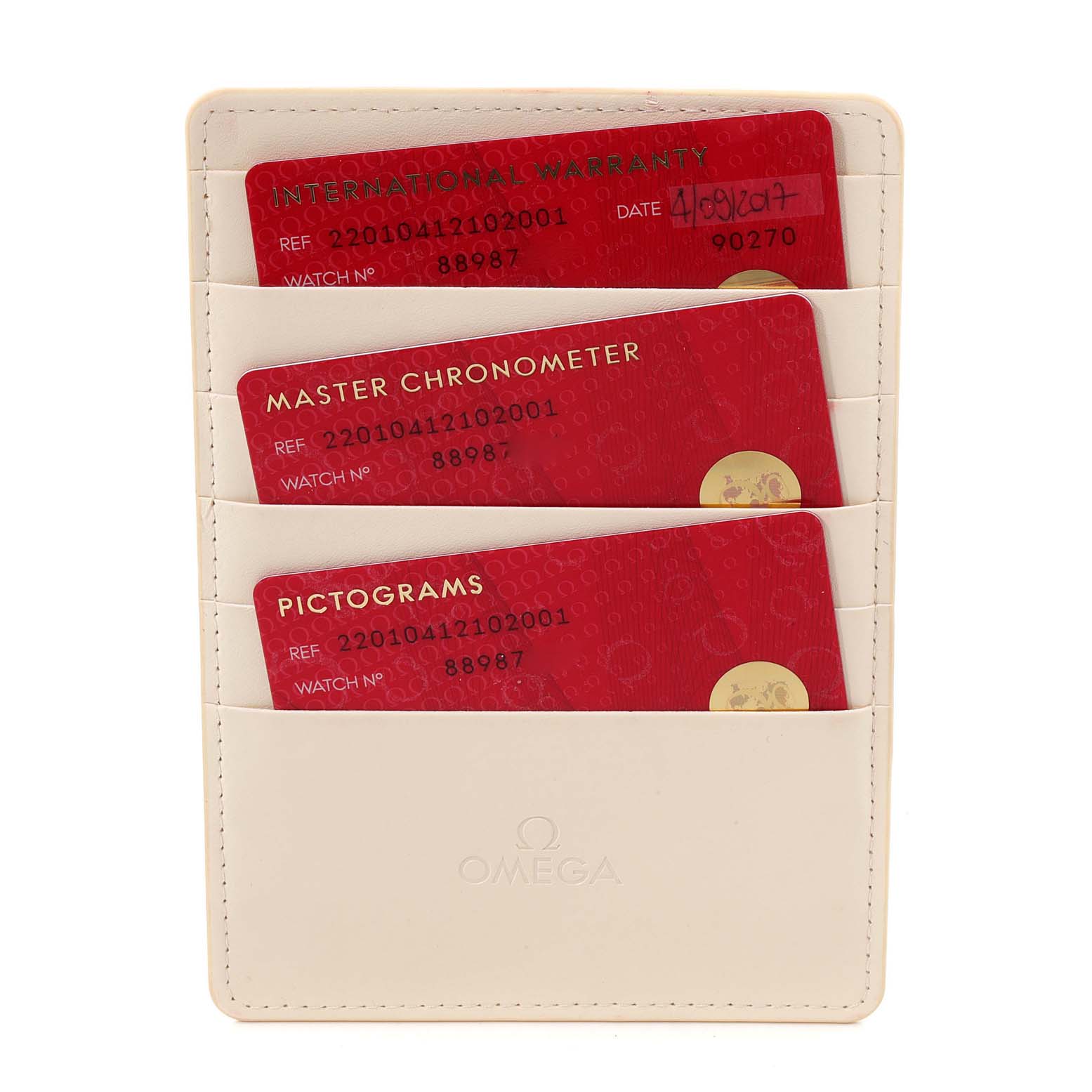 The image shows an Omega Aqua Terra 220.10.41.21.02.001 Men
s Stainless Steel Silver Dial 220.10.41.21.02.001 Men
s Stainless Steel Silver Dial model
s warranty cards in a beige cardholder from a front angle.