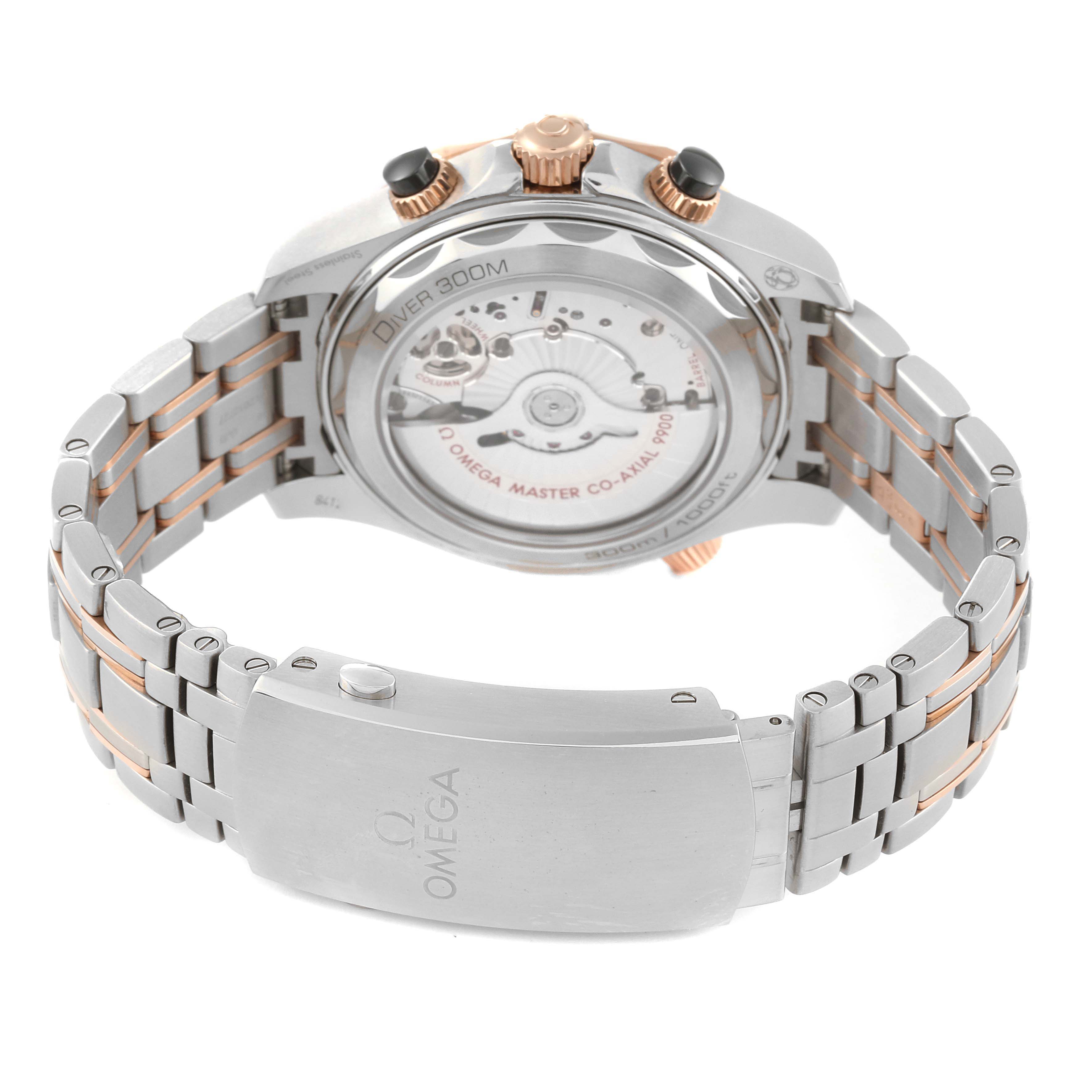 The Omega Seamaster 210.20.44.51.01.001 Men's Steel and Gold (two tone) Black Dial 210.20.44.51.01.001 Men's Steel and Gold (two tone) Black Dial watch is shown from the back, displaying the case back, movement, and metal bracelet with a deployment clasp.