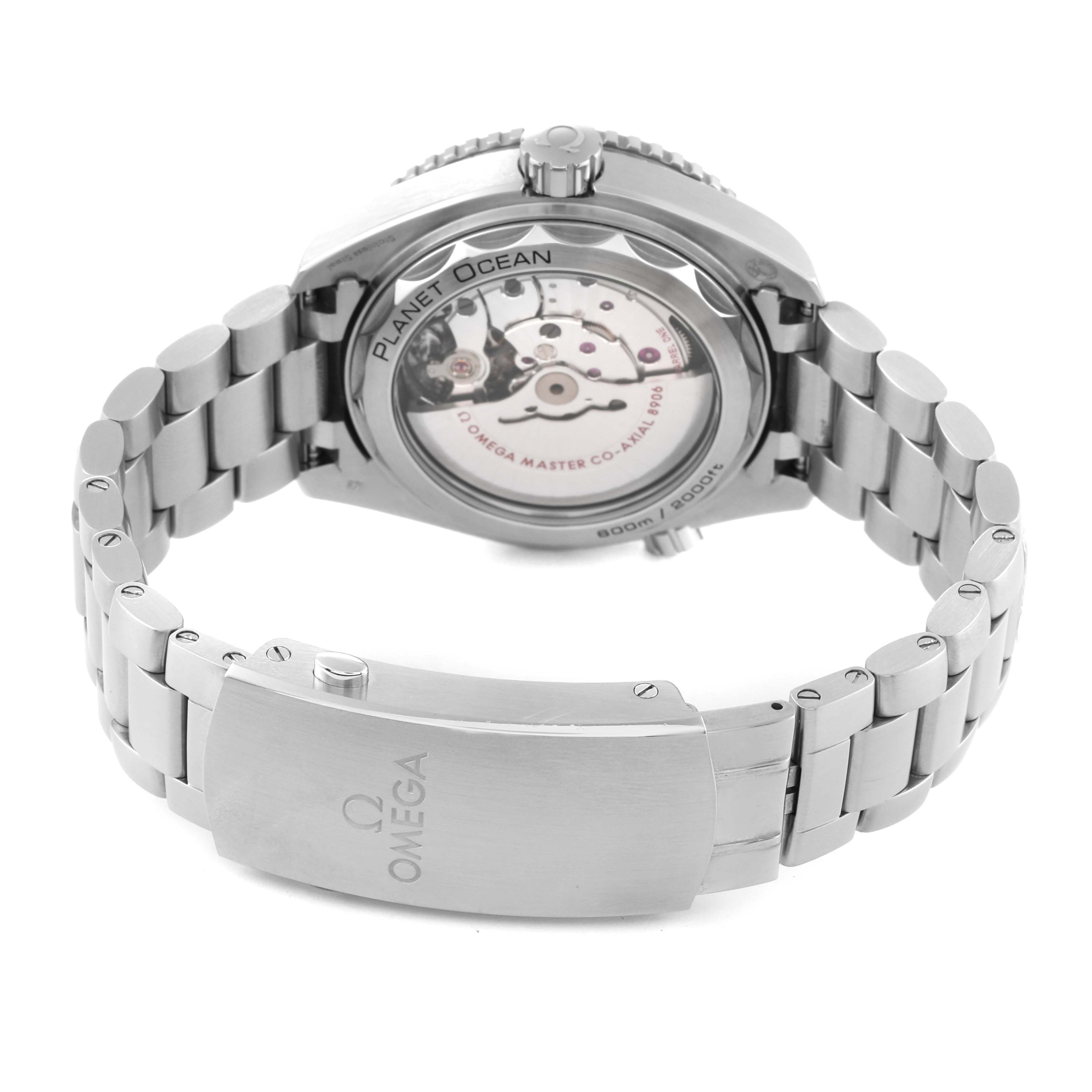 The image shows the back view of the Omega Planet Ocean 215.30.44.22.01.001 Men
s Stainless Steel Black Dial 215.30.44.22.01.001 Men
s Stainless Steel Black Dial watch, highlighting its movement and the stainless steel bracelet with the clasp.