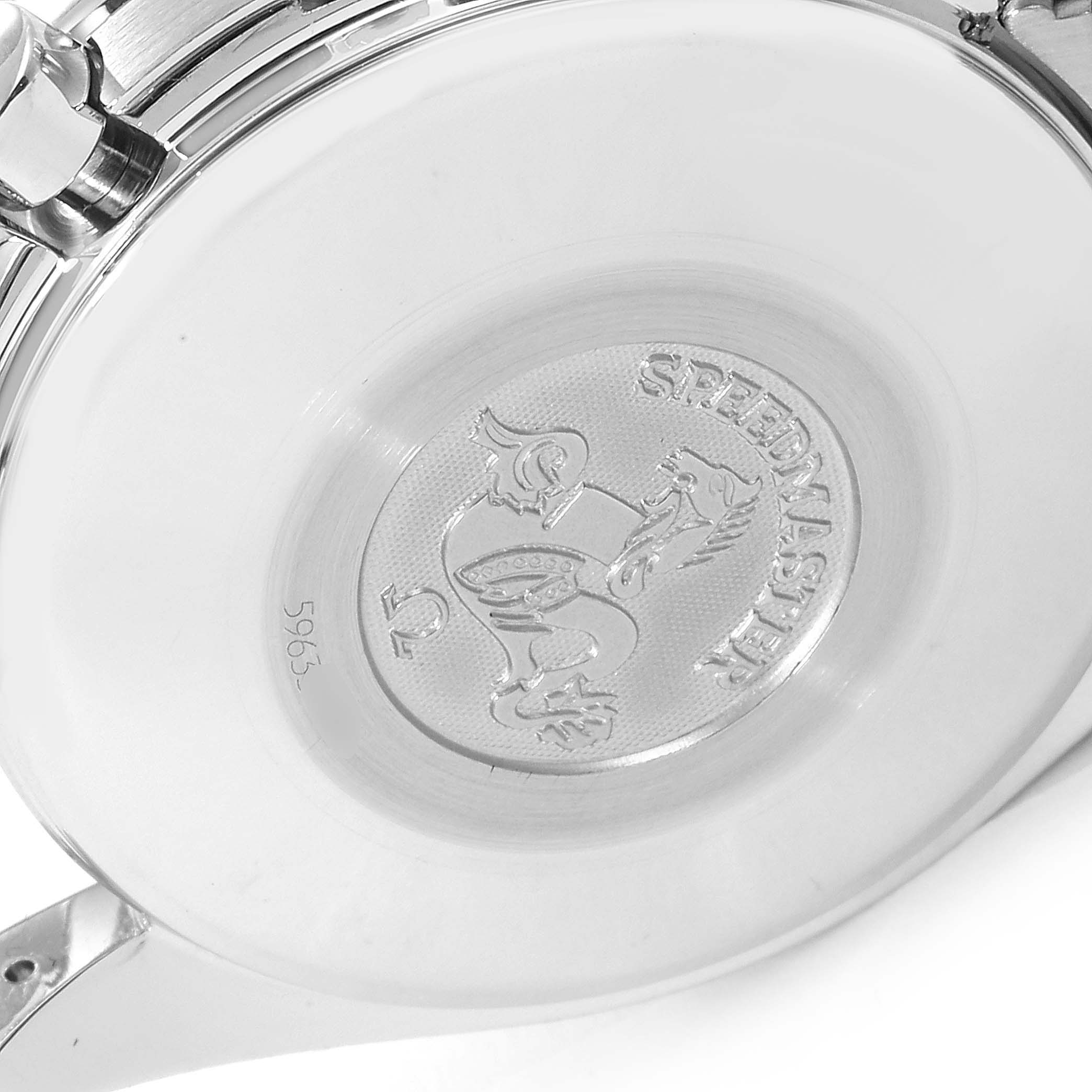 The image shows the case back of an Omega Speedmaster 3523.30.00 Men
s Stainless Steel Silver Dial 3523.30.00 Men
s Stainless Steel Silver Dial watch, highlighting the embossed logo and some engravings.