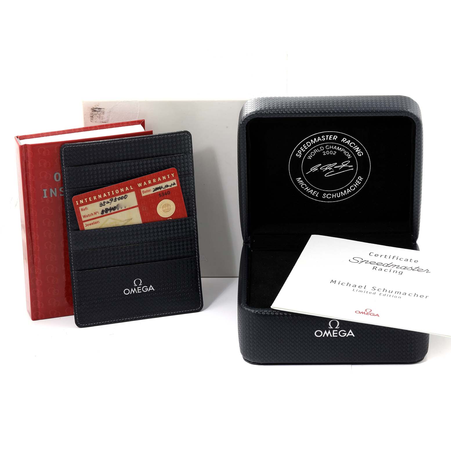 The image shows the packaging, warranty card, instruction manual, and certificate for an Omega Speedmaster 3529.50.00 Men's Stainless Steel Black Dial 3529.50.00 Men's Stainless Steel Black Dial Racing watch.