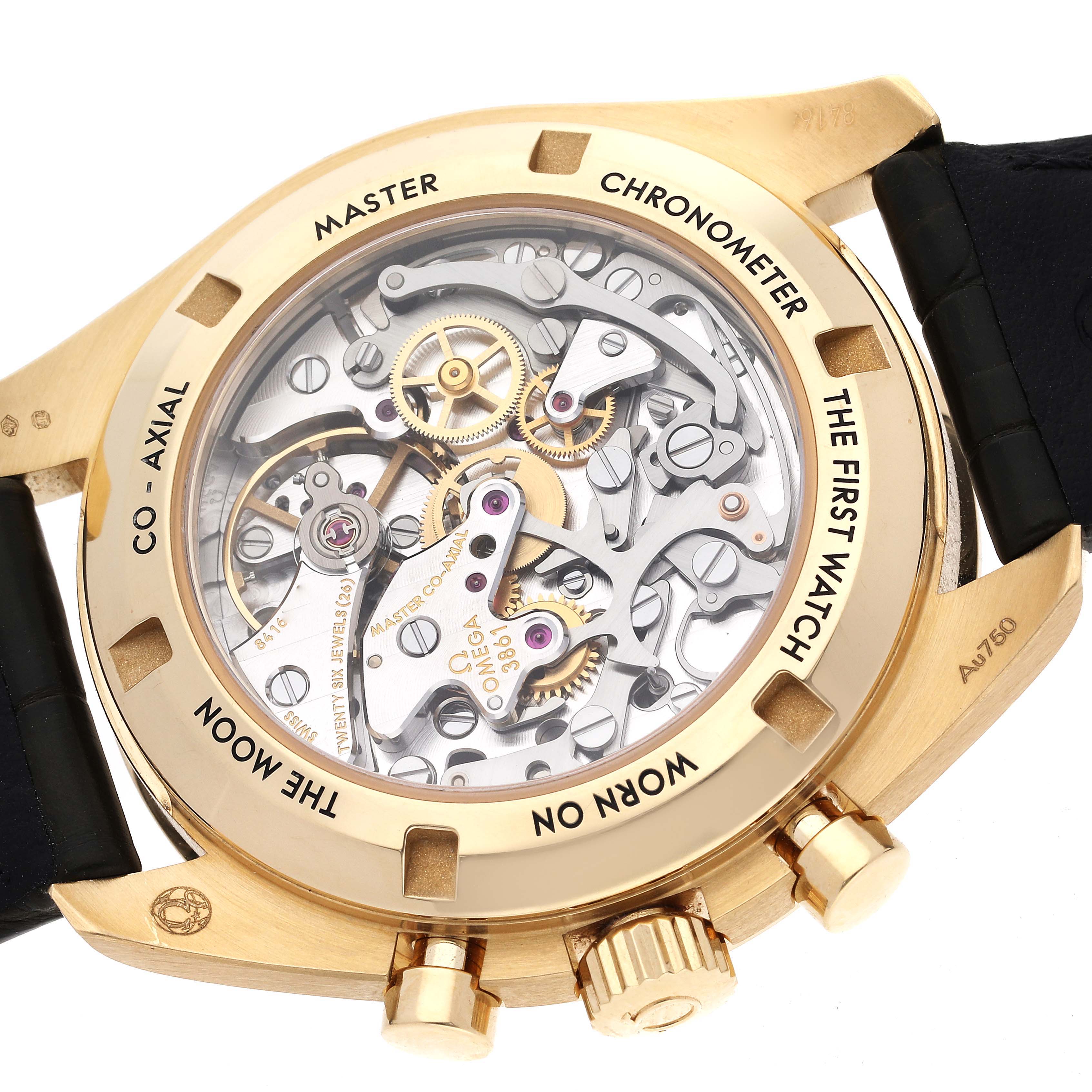 This image shows the back of an Omega Speedmaster 310.63.42.50.10.001 Men's Yellow Gold Green Dial 310.63.42.50.10.001 Men's Yellow Gold Green Dial watch, revealing the intricate mechanical movement and "co-axial" chronometer mechanism.