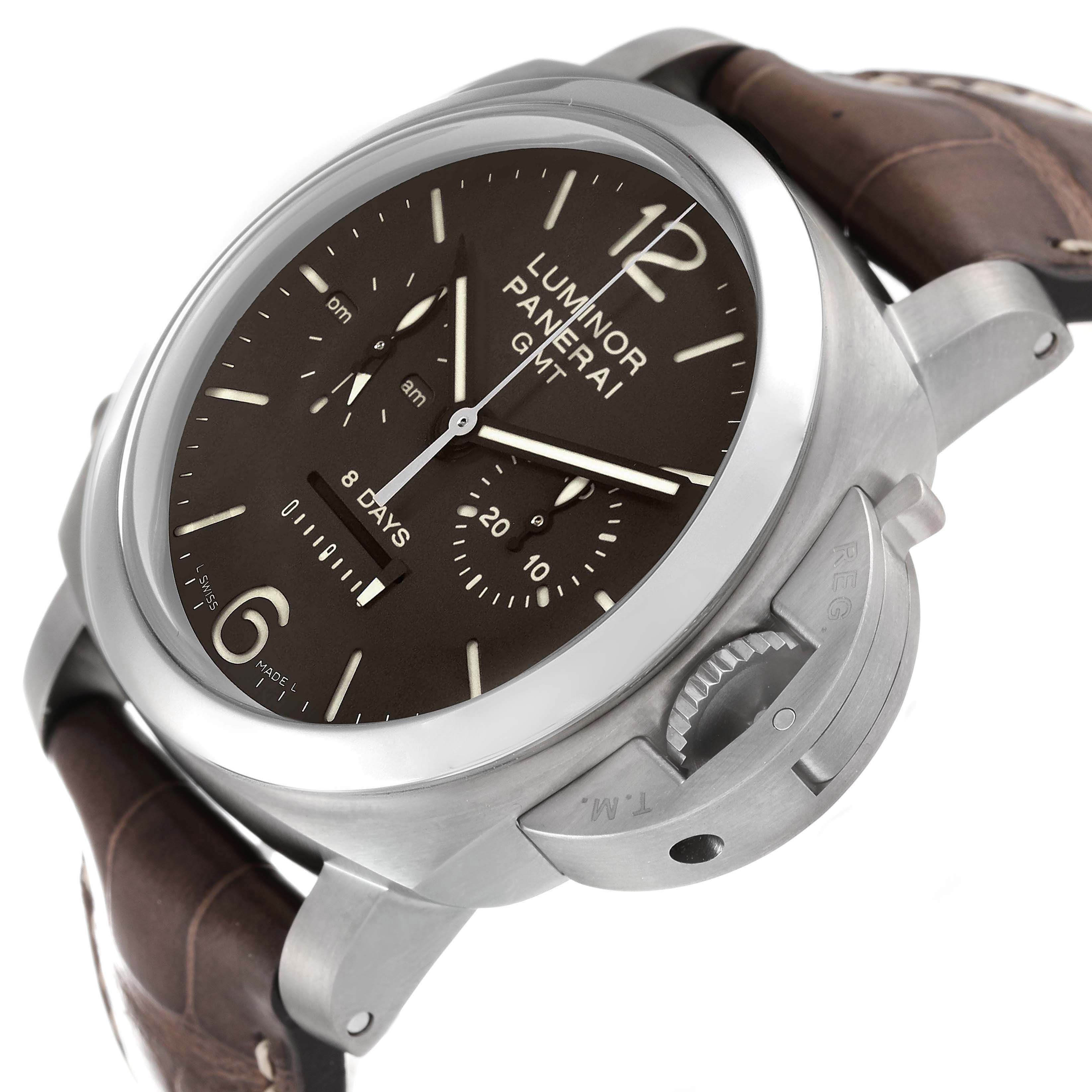 The Panerai Luminor PAM00311 Men
s Titanium Brown Dial watch is shown from a three-quarter view, highlighting the dial, crown guard, and leather strap.