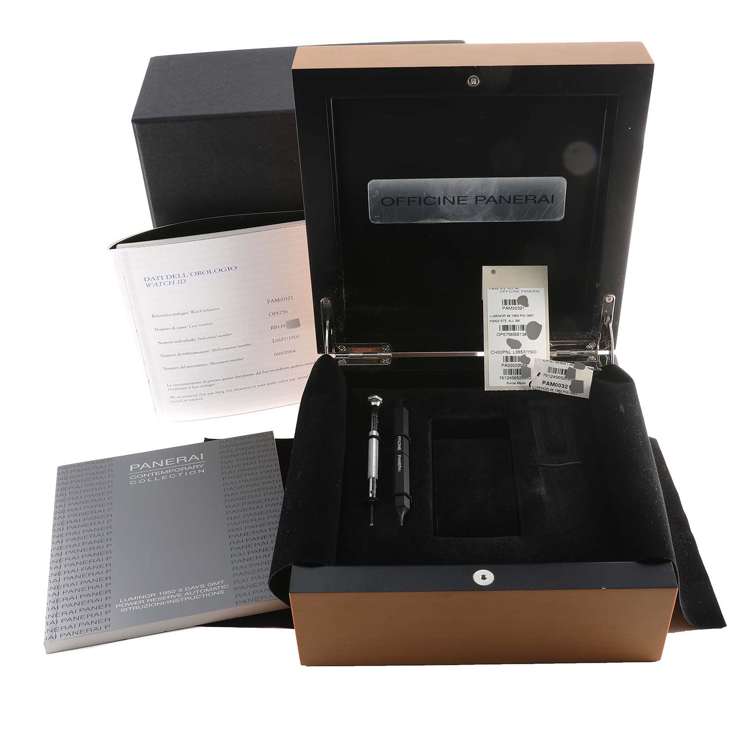 This image shows the open packaging box of a Panerai Luminor PAM00321 Men
s Stainless Steel Black Dial PAM00321 Men
s Stainless Steel Black Dial watch, including tags, documents, and tools.