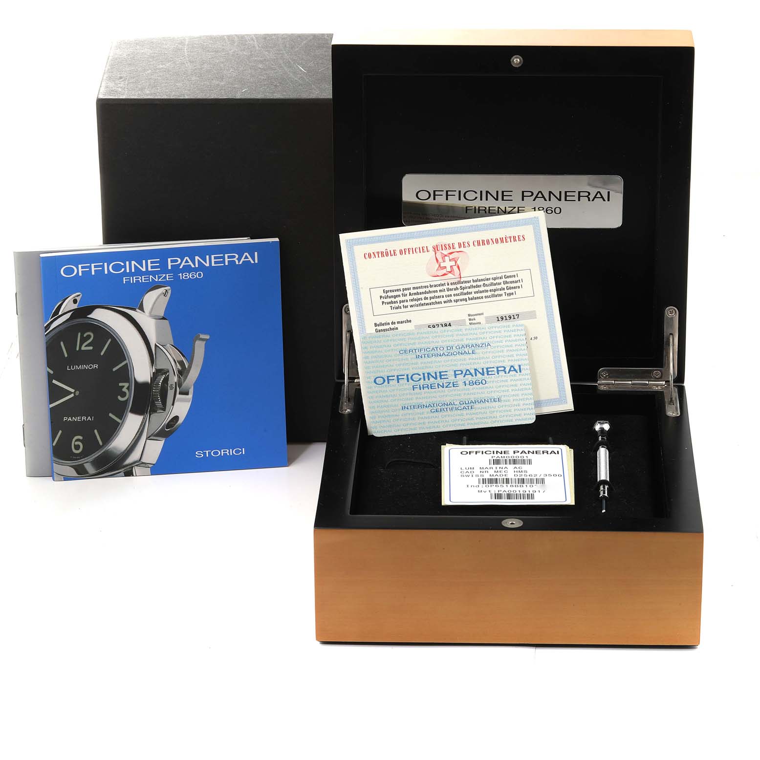 The image shows the packaging for the Panerai Luminor PAM00001 Men's Stainless Steel Black Dial PAM00001 Men's Stainless Steel Black Dial watch, including the box, booklets, warranty papers, and a tool.