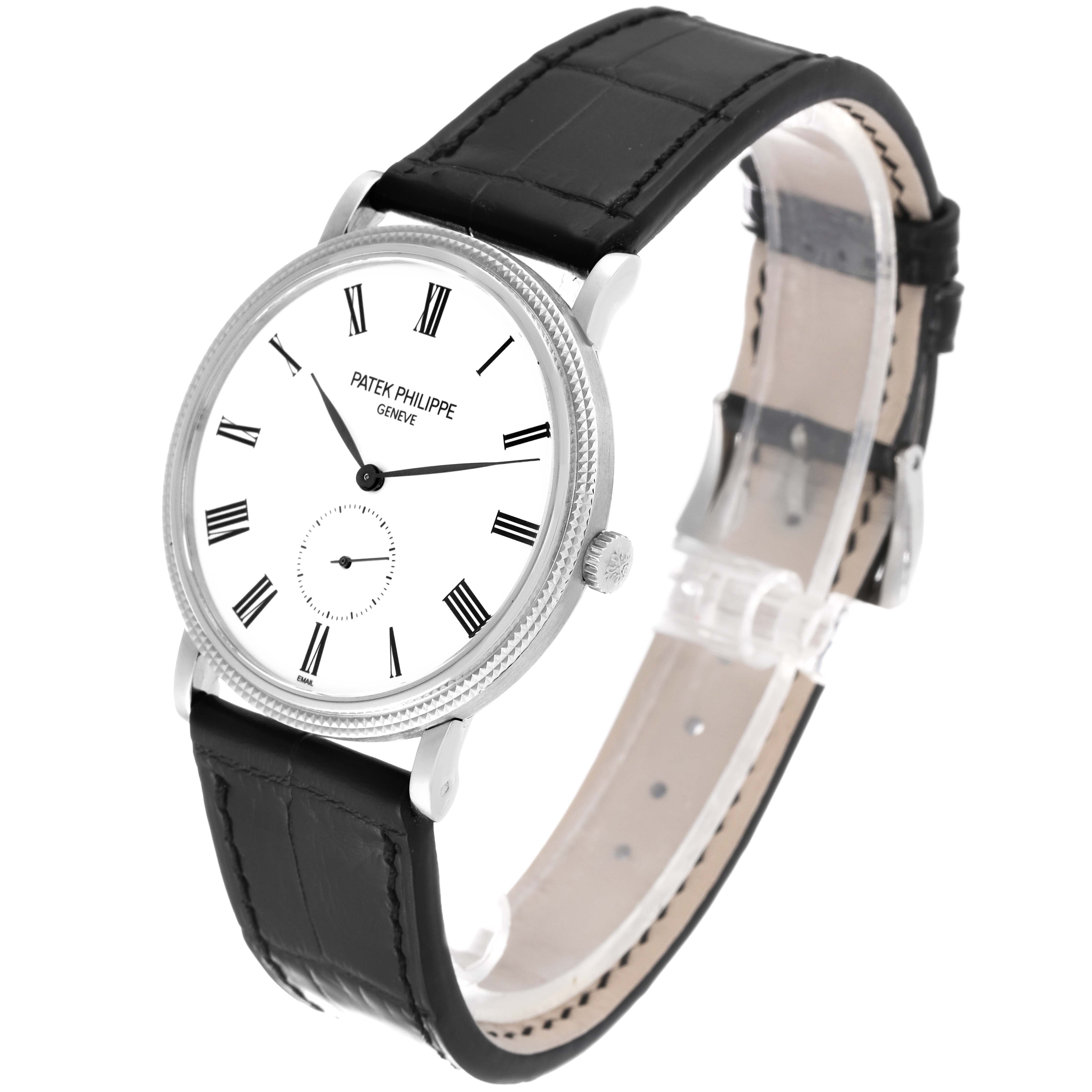 The image shows a Patek Philippe Calatrava 5116G Men
s White Gold White Dial 5116G Men
s White Gold White Dial watch at a slight angle, revealing the face, black leather strap, and side crown.