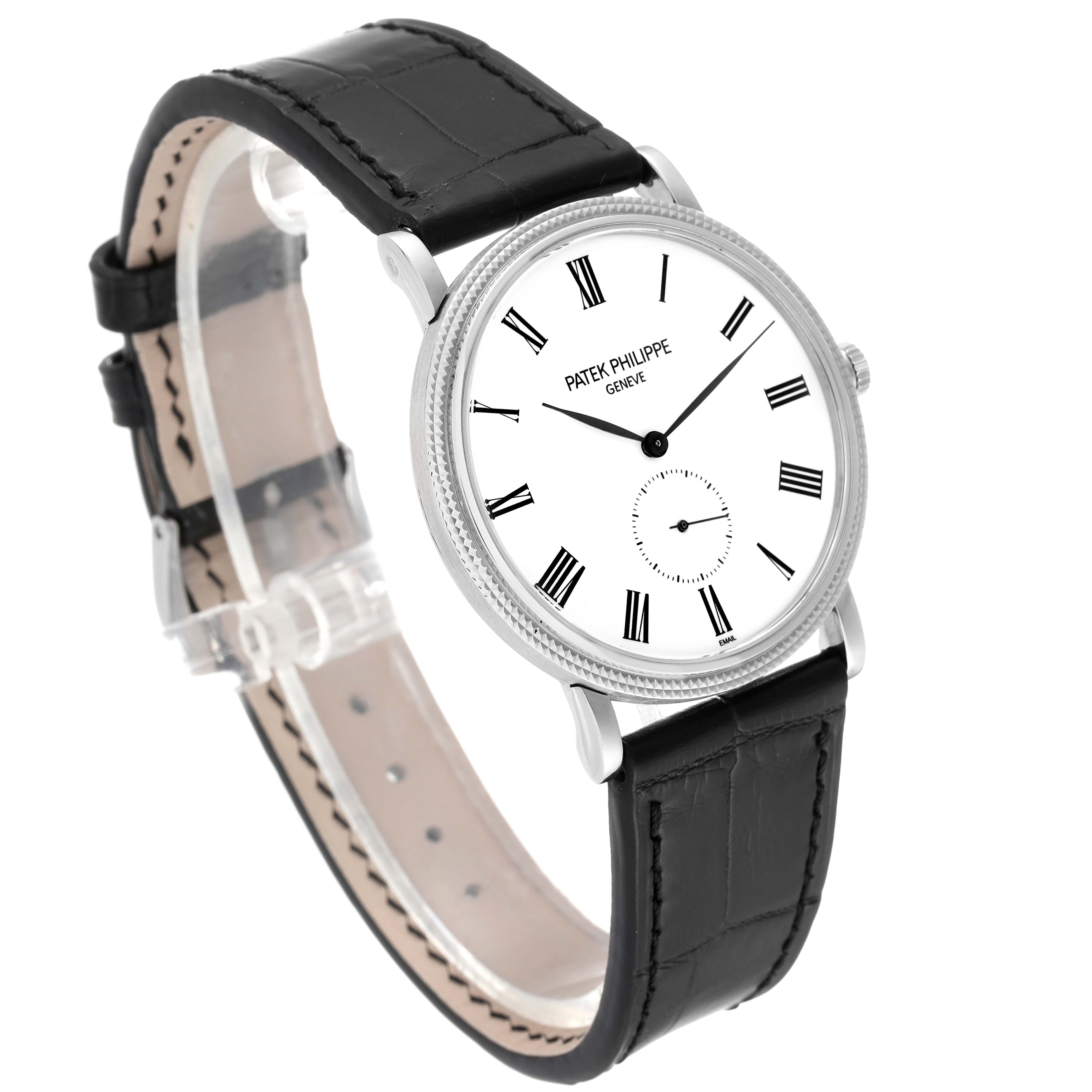 The image shows a Patek Philippe Calatrava 5116G Men
s White Gold White Dial 5116G Men
s White Gold White Dial watch with a black leather strap and a white dial at a slight side angle.