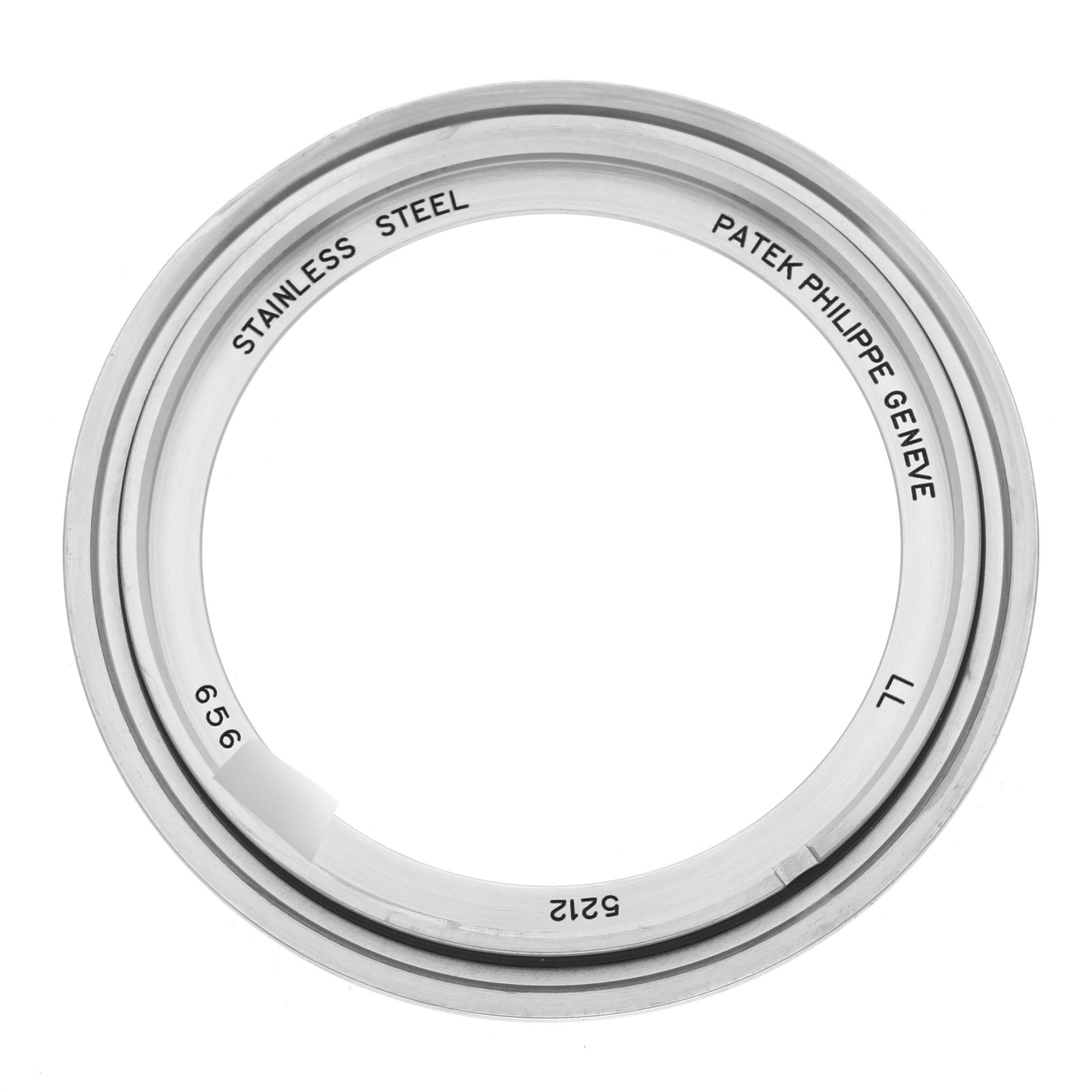 This image shows a top-down view of a stainless steel bezel for a Patek Philippe Complications 5212A-001 Men's Stainless Steel Silver Dial 5212A-001 Men's Stainless Steel Silver Dial model watch.