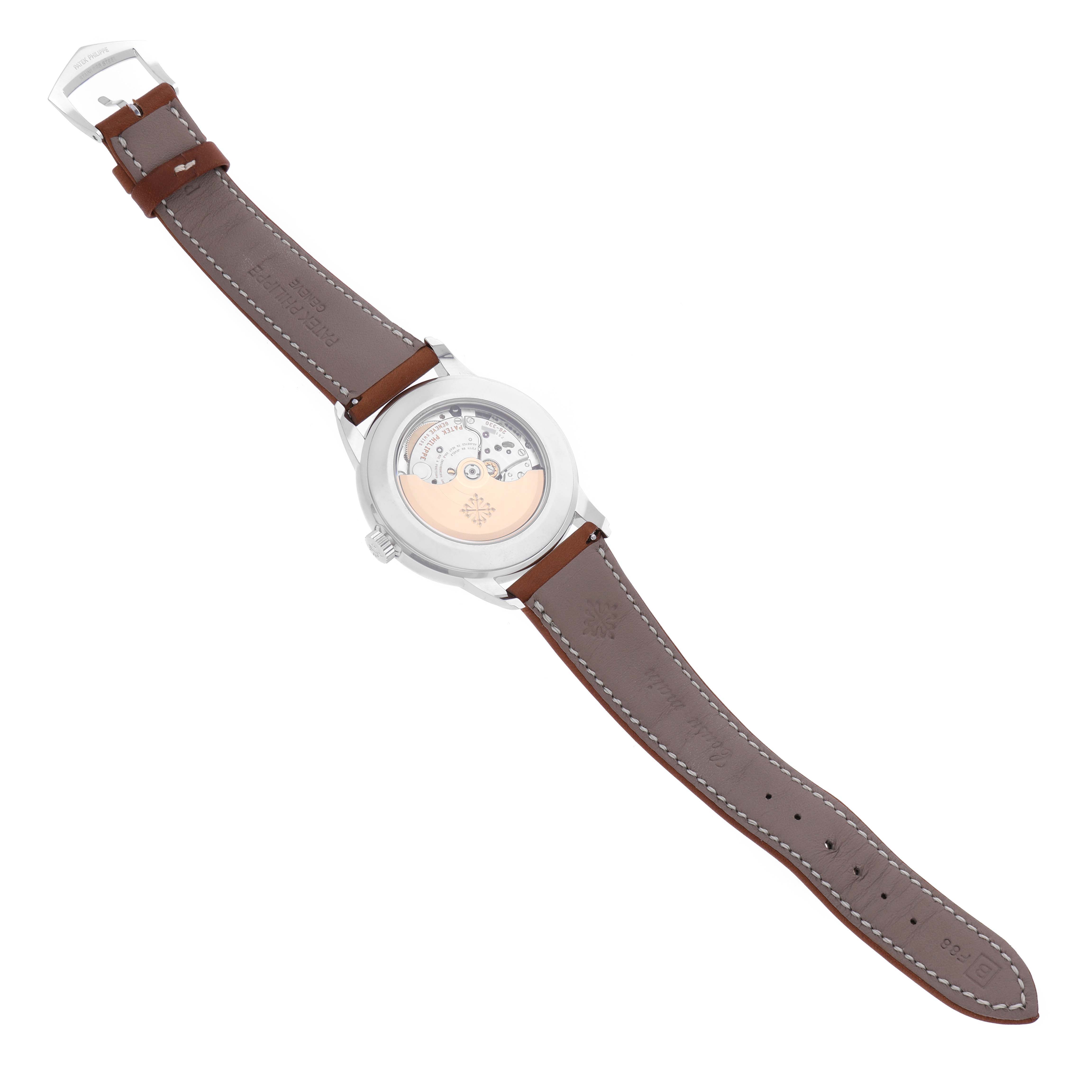 The Patek Philippe Complications 5212A-001 Men's Stainless Steel Silver Dial 5212A-001 Men's Stainless Steel Silver Dial watch is shown from the back, displaying the movement and brown leather strap.