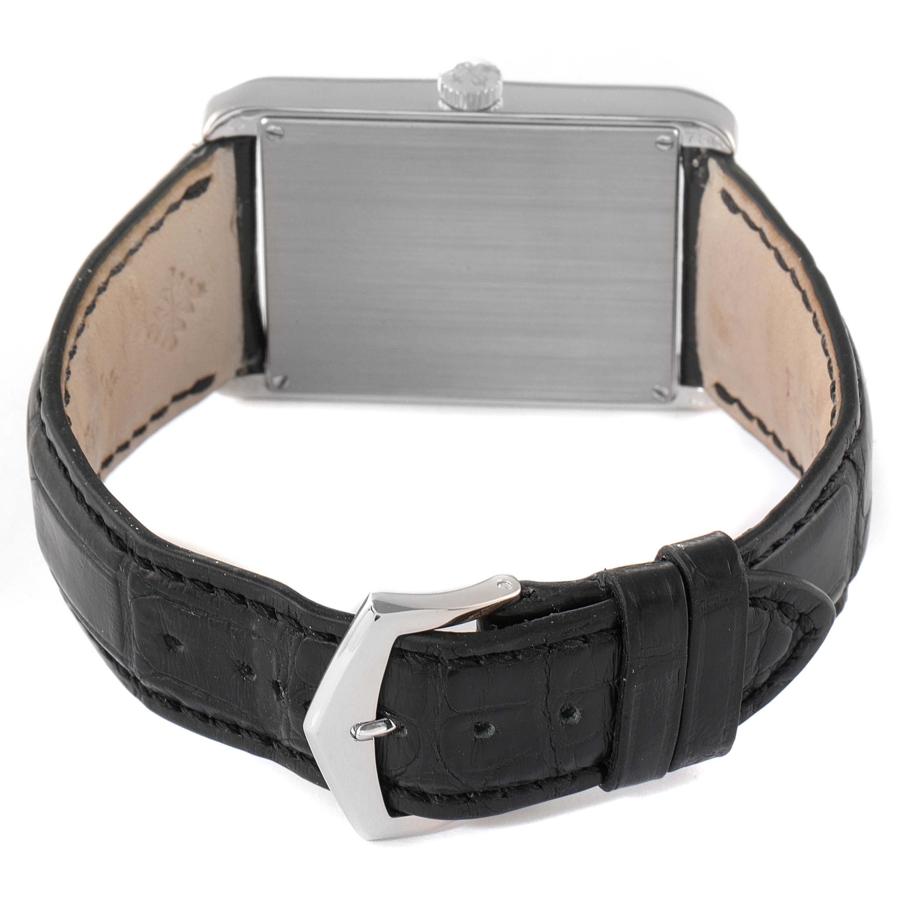 The image shows the back view of a Patek Philippe Gondolo 5109G Men's White Gold Silver Dial 5109G Men's White Gold Silver Dial watch with a black leather strap and a stainless steel buckle.