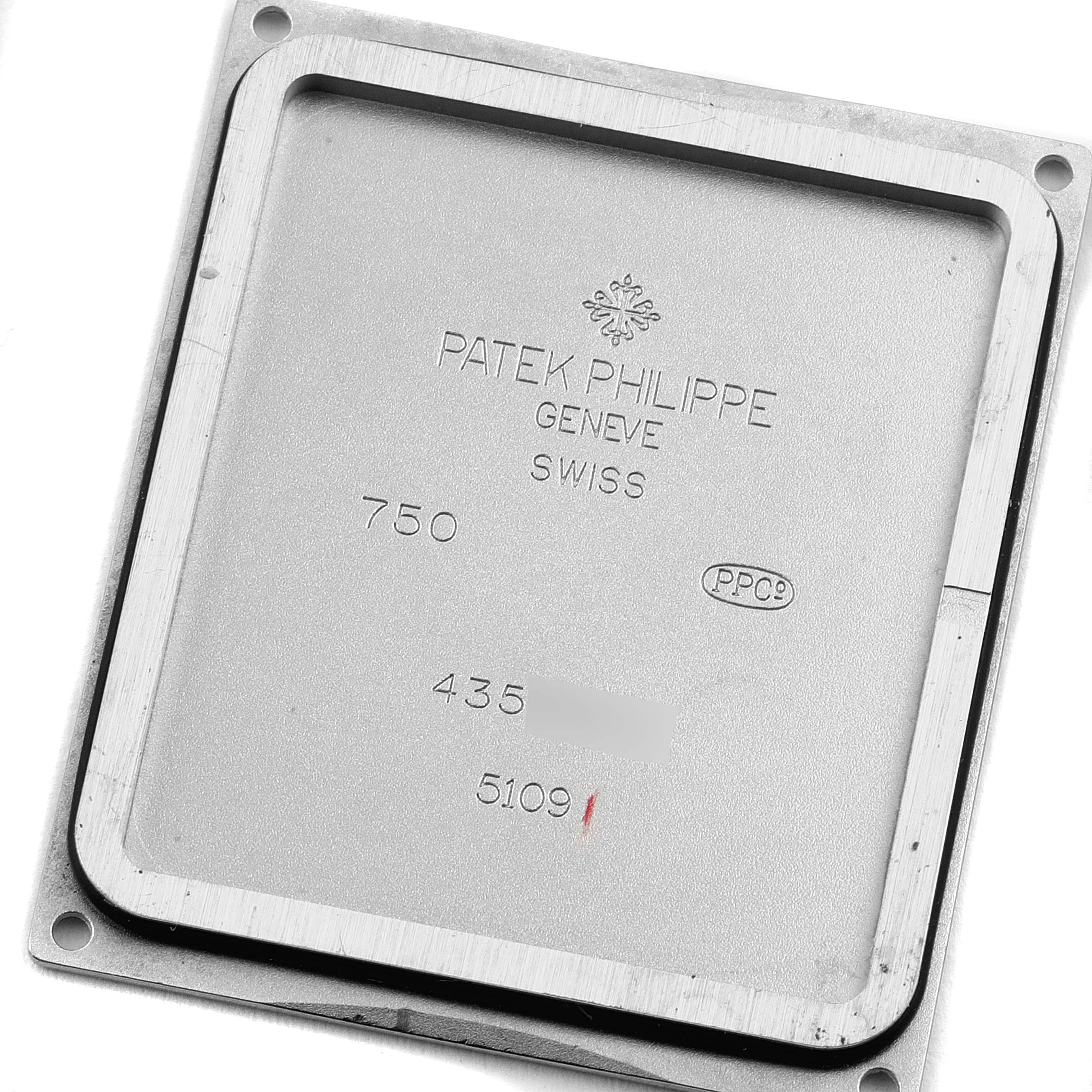 This image shows the case back of a Patek Philippe Gondolo 5109G Men's White Gold Silver Dial 5109G Men's White Gold Silver Dial watch, featuring brand engravings and serial numbers.