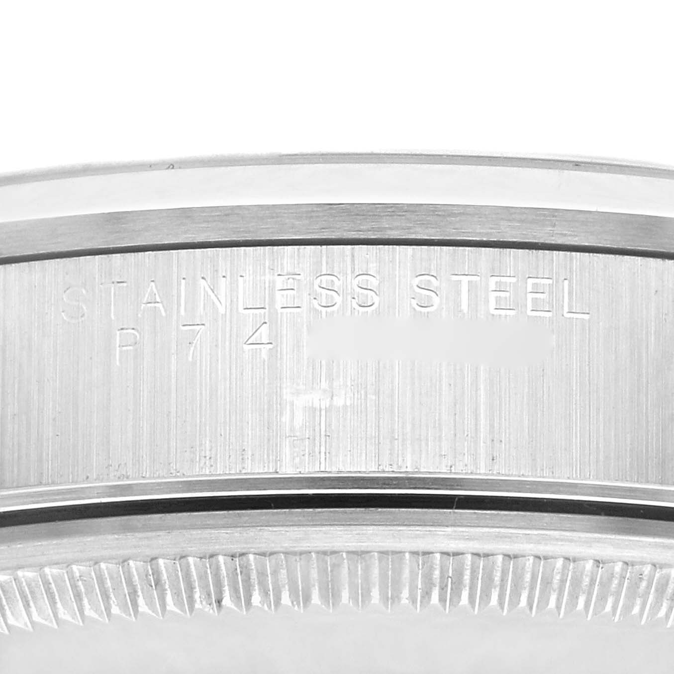 This image shows a close-up view of the stainless steel case back of a Rolex Air-King 14000M Men's Stainless Steel Blue Dial 14000M Men's Stainless Steel Blue Dial watch.