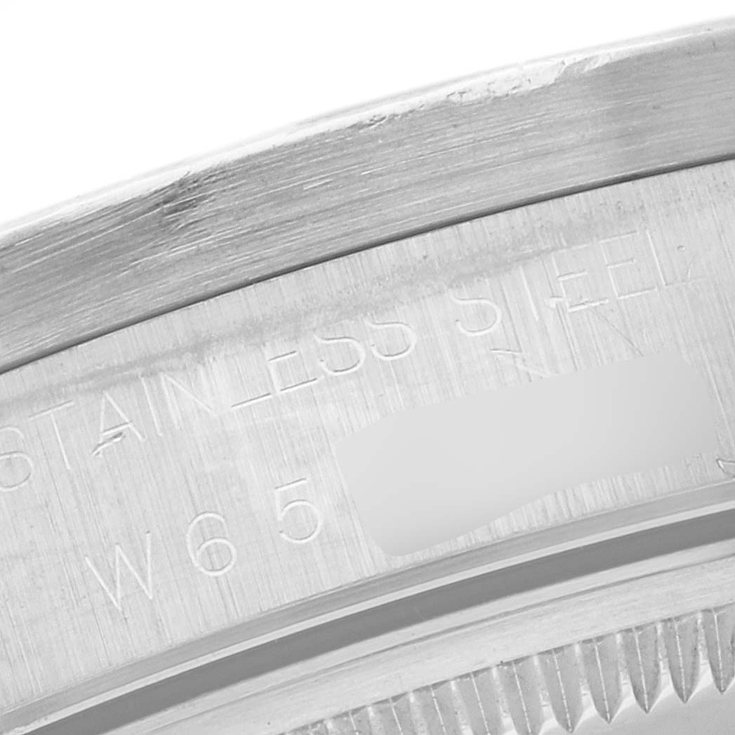 This image shows a close-up of the stainless steel engraved inner bezel of a Rolex Air-King 14010 Men's Stainless Steel Black Dial 14010 Men's Stainless Steel Black Dial watch.