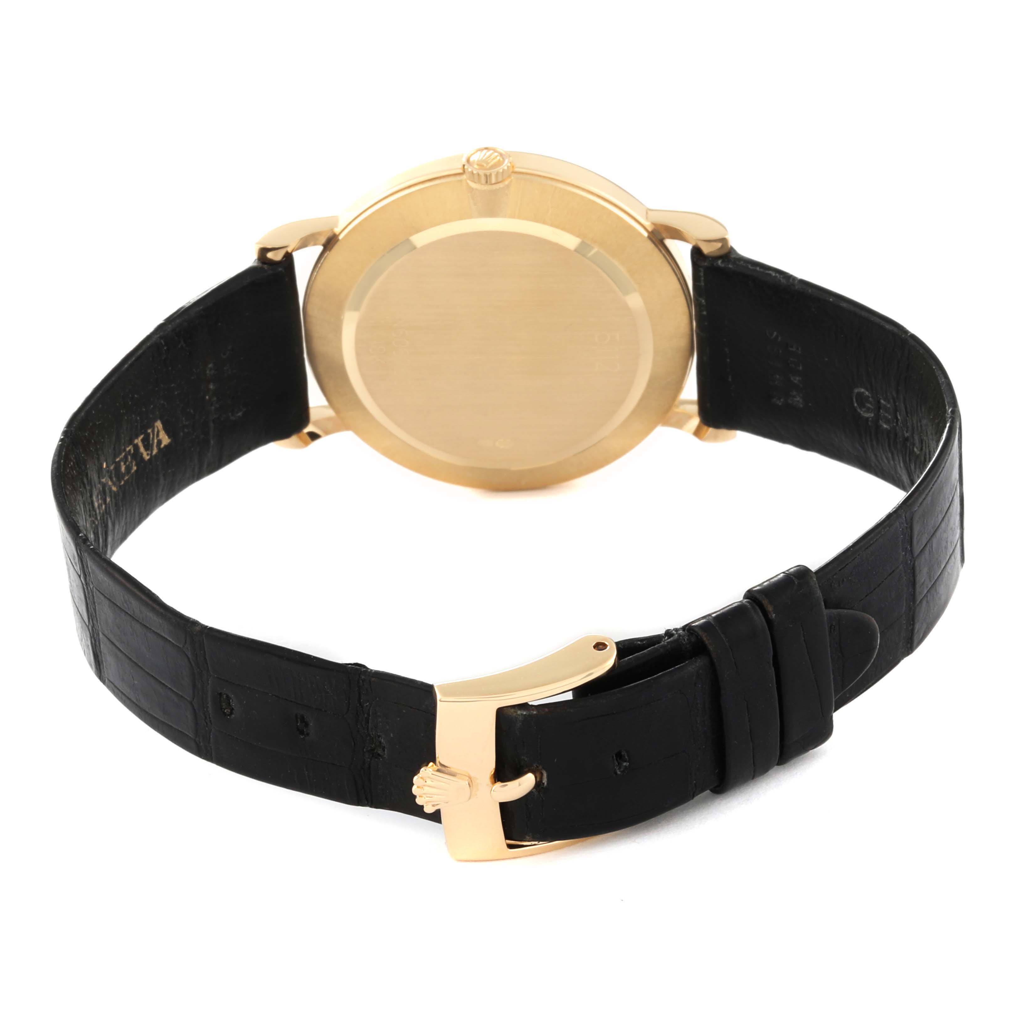 The image shows the back view of the Rolex Cellini 5112 Men's Yellow Gold White Dial 5112 Men's Yellow Gold White Dial watch, highlighting the case, crown, and black leather strap with a gold buckle.