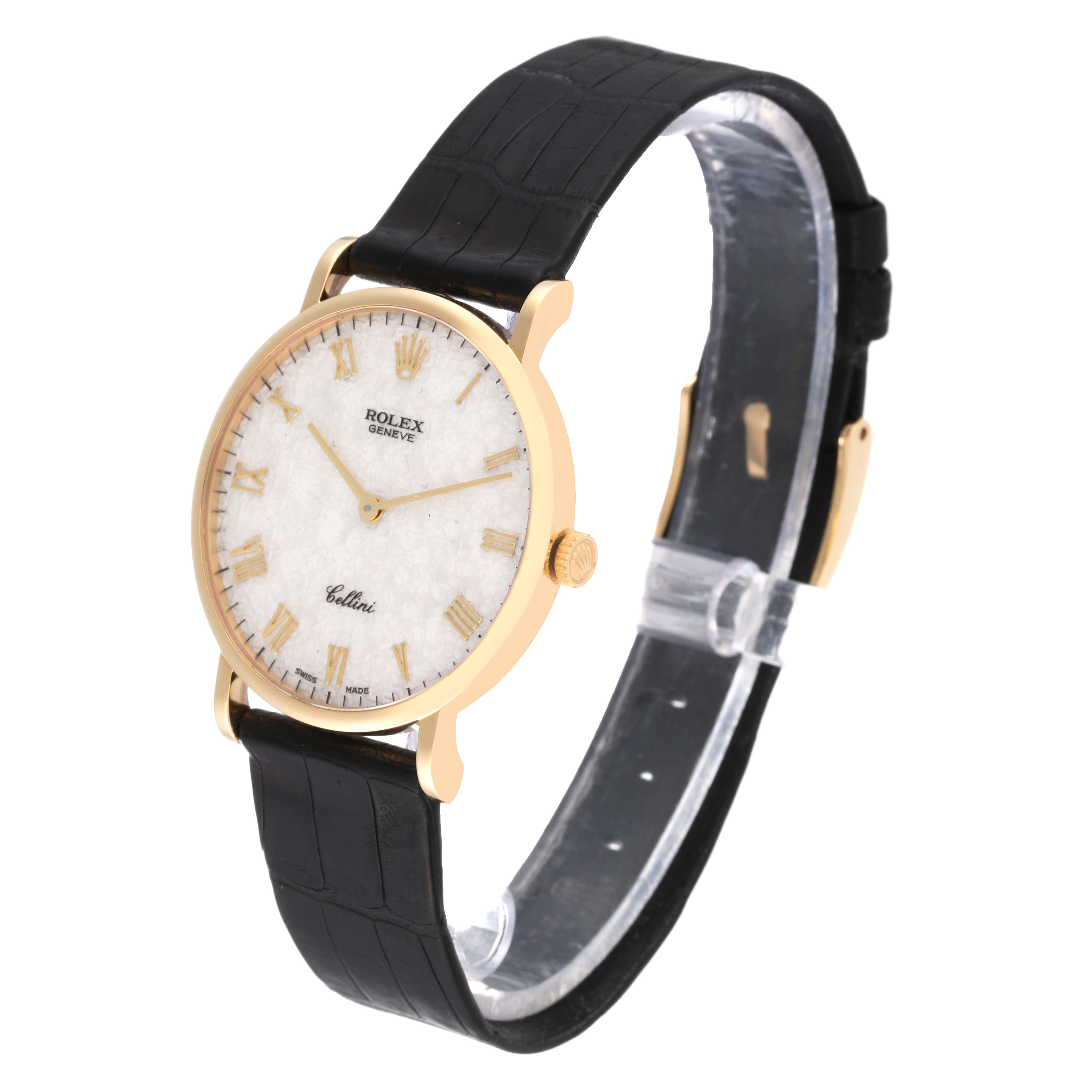 The Rolex Cellini 5112 Men's Yellow Gold White Dial 5112 Men's Yellow Gold White Dial watch is shown at a slight angle displaying its dial, bezel, crown, and black leather strap.